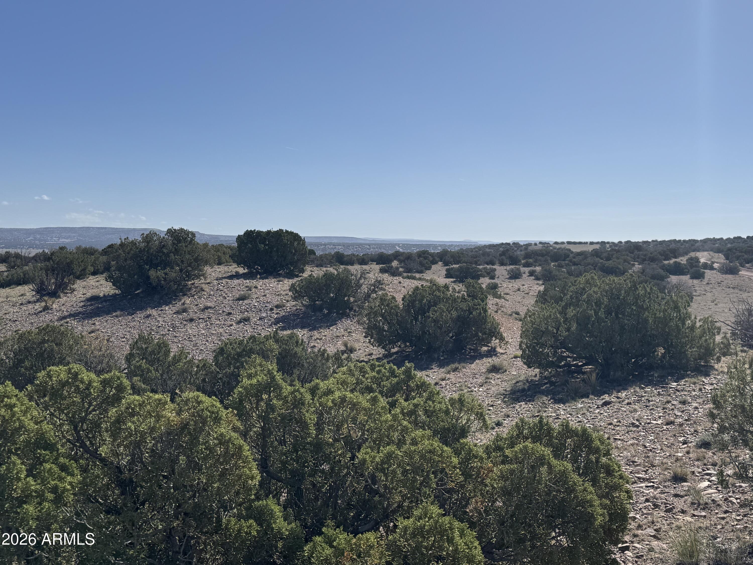36.25 acres of beautiful off-grid land in Woodland Valley Ranch! Peaceful, quiet setting with fabulous views and a mild four-season climate -- temperatures rarely exceed 100°, average around 45° in January, and snowfall is minimal at approximately 20'' annually. Roads are maintained by the POA with very few restrictions. Camp, build your dream home or cabin, or enjoy full-time RV living. The adjacent parcel is also available at the same price, creating a rare opportunity to own two side-by-side properties together. Escape the crowds and enjoy wide-open space, privacy, and endless possibilities! Seller financing available.