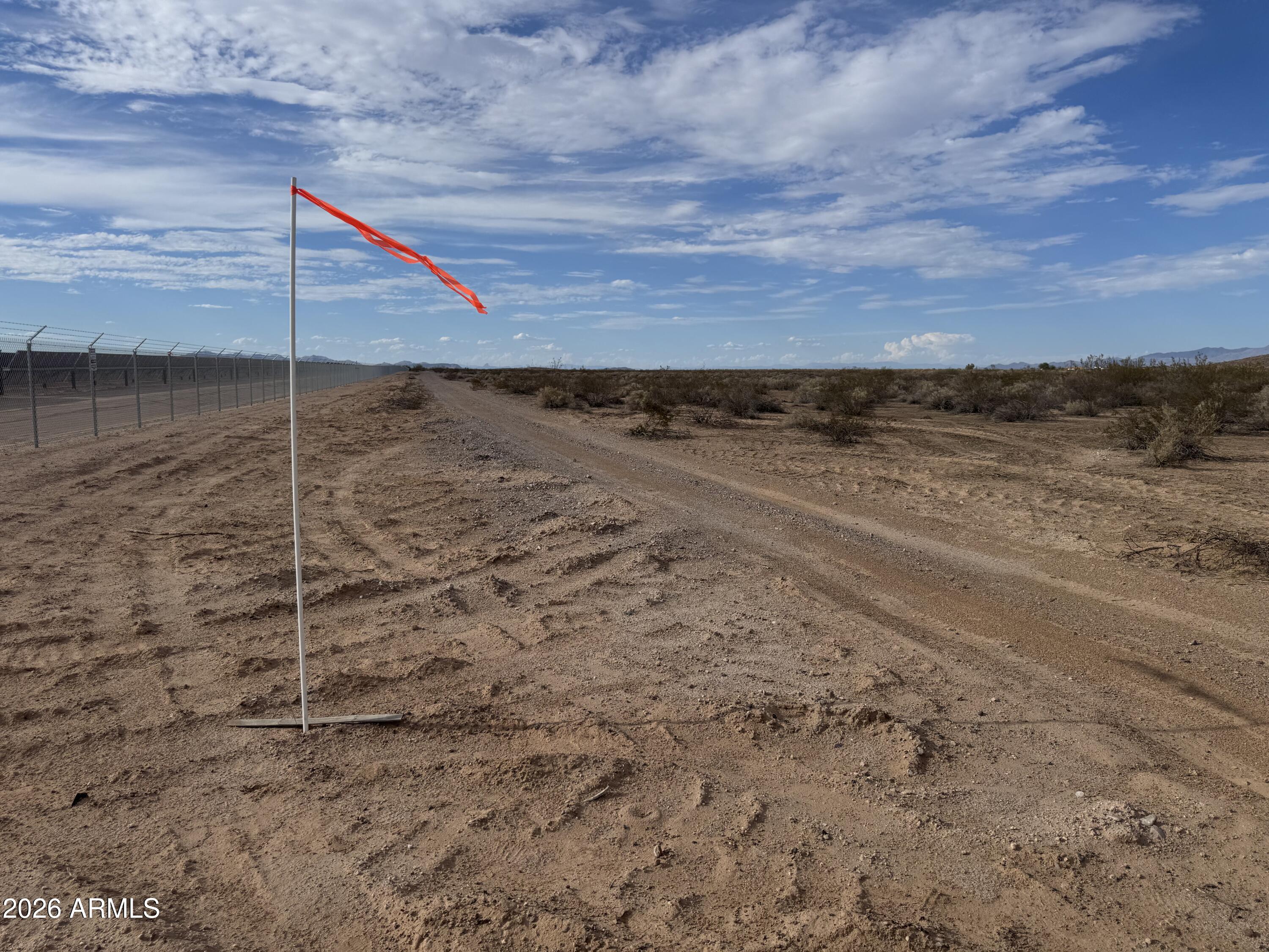 NW Property Corner Approximately Here: 33.386641, -112.837456  Private End-of-Road Retreat - Only $6,000/Acre! Tucked at the end of the road for maximum privacy, this elevated parcel offers sweeping views and a dramatic mountain backdrop -- all outside the flood zone. The terrain is ideal for off-grid building sites, with a flat western portion perfect for a home, barn, or outbuildings, and a mountainous eastern section ready-made for a private hiking trail, shooting range, or simply untouched open space. Whether you're looking to build one estate-sized property that's hard to match anywhere else in the area, or to split the parcel and create distinct living and recreation zones, the possibilities here are wide open. Opportunities like this in Tonopah don't last - come see it for yourself!
