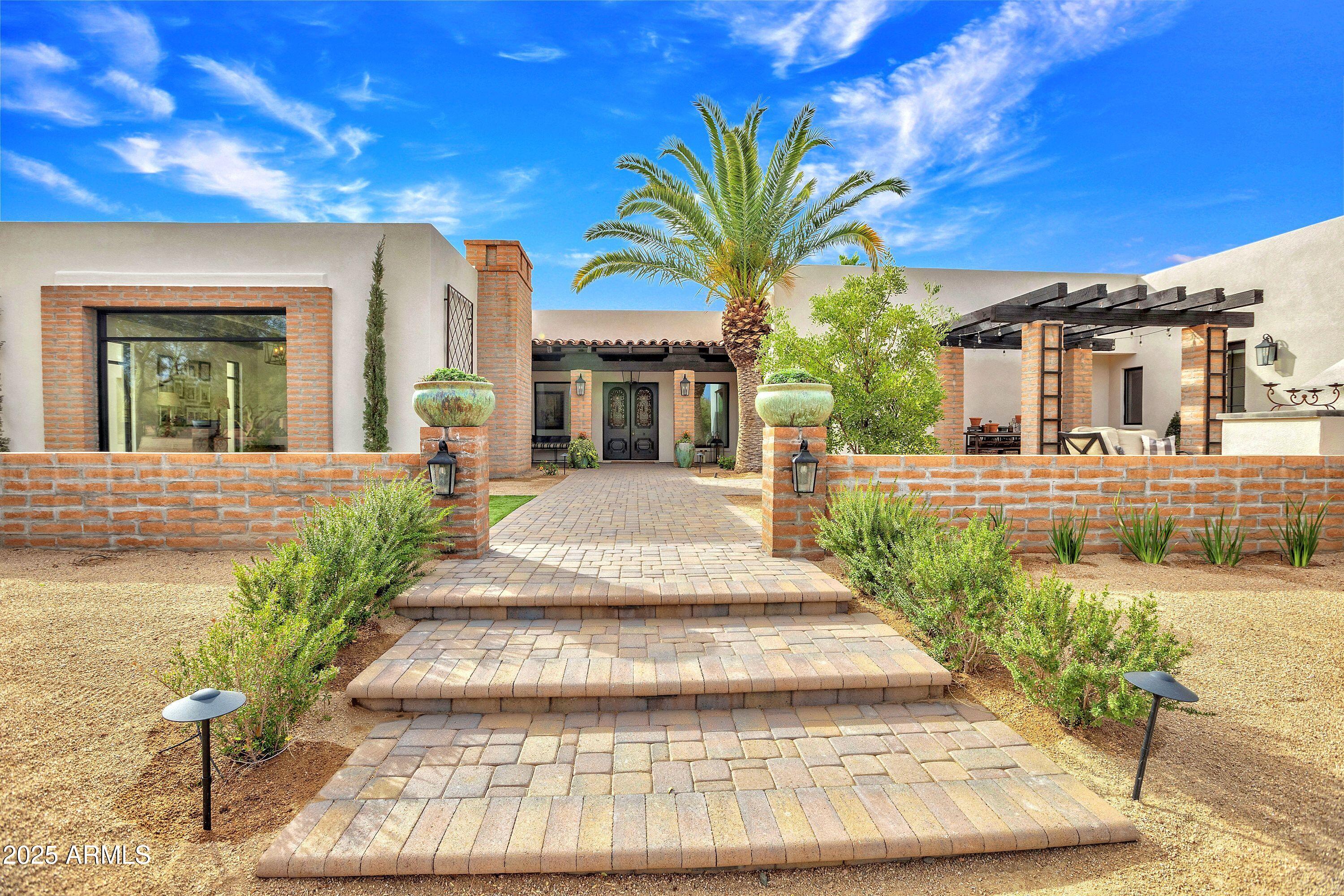 4.5 acre horse property in North Scottsdale/Cave Creek on County Island. Remodeled home on expansive property offering amazing possibilities. Stone and wood flooring throughout, the kitchen features top-of-the-line Blue Star appliances, including a Sub-Zero refrigerator, and granite countertops. Office includes a built-in Fort Knox safe and private patio. All bedrooms are en-suite with large closets. Outside, you'll find a newly built pool and spa, complete with a mist system. Stereo system throughout entire home and exterior. Roof recently recoated in 2024, all windows brand new 2024, two tankless water heaters and an upgraded electrical panel. Main house boasts a spacious bonus room with full kitchen, bathroom and laundry, perfect for guests or multi-generational living. Home includes a new construction 3 car and class A RV garage, plans with builder and pending county approval. 6 stall barn with large turnouts, flexible horse fencing, double wash rack, fly spray misting system, covered shaving area and expansive roping arena. Additional features include a shop/garage for extra storage or parking. Large 20x20 bonus room at barn plumbed for kitchen and bathroom. Horse friendly community with riding path out the front gate.