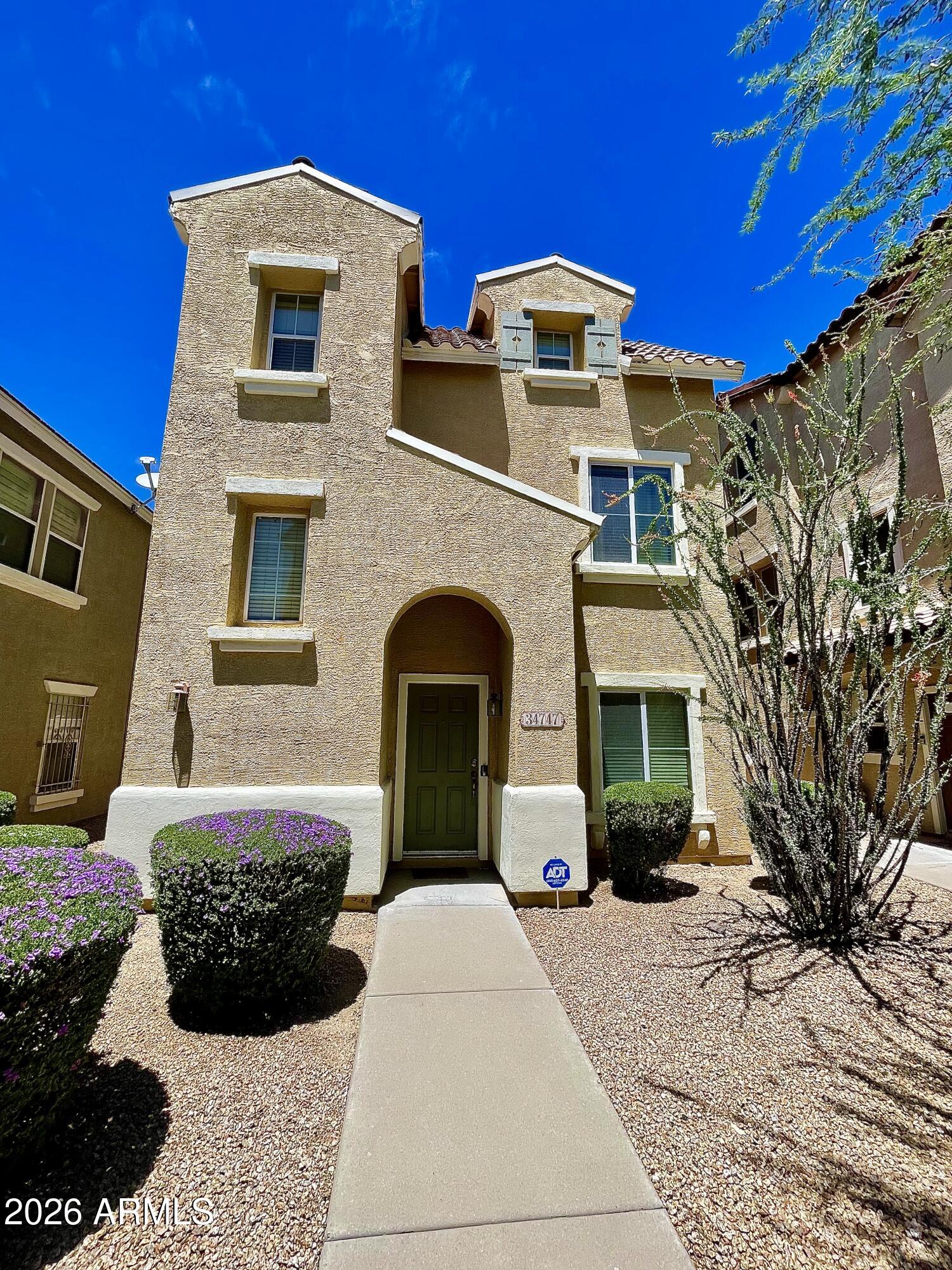 Don't miss this incredible opportunity to own a spacious 1,600+ square foot single-family home in the highly desirable Tramonto community of North Phoenix. This upgraded three-level home features wood flooring, black granite countertops, a stainless steel under mount sink, upgraded light fixtures and ceiling fans. The kitchen opens seamlessly to a bright and inviting great room, creating the perfect space for both everyday living and entertaining. The lower level offers a two-car garage, laundry area, powder room, and a versatile bonus room. The main level features the kitchen, great room, two secondary bedrooms, and a full bathroom. The upper level serves as a private primary retreat with a spacious bedroom, sitting area, large walk-in closet, and private bath. Residents enjoy access to two community pools, tennis courts, and the many amenities that make Tramonto one of North Phoenix's most sought-after communities. Conveniently located within walking distance to shopping, dining, hiking and biking trails, and just minutes from I-17 and Lake Pleasant, this home offers the perfect combination of comfort, convenience, and an active Arizona lifestyle. Whether you are looking for a primary residence, second home, or investment opportunity, this exceptional property is one you won't want to miss.