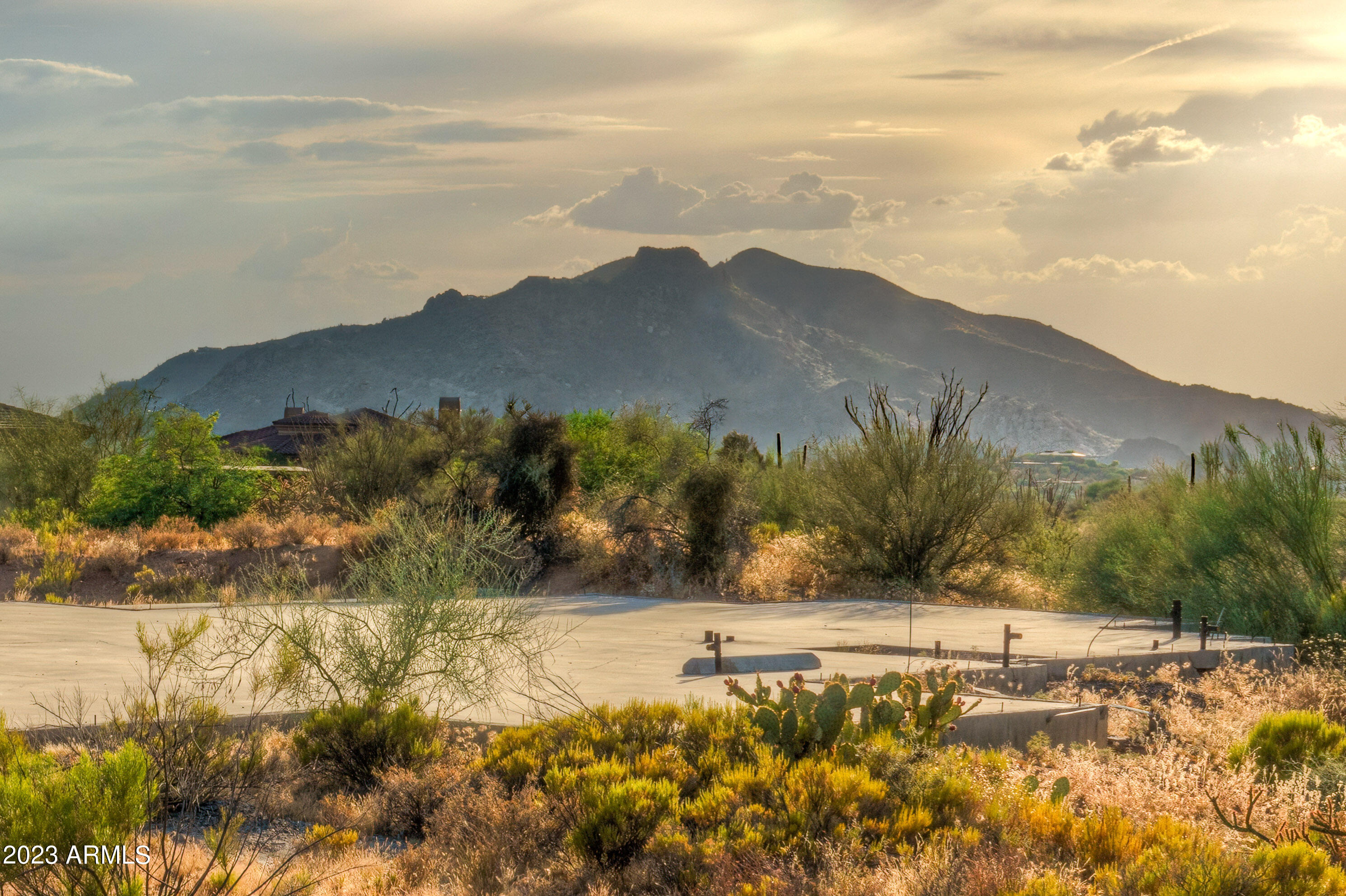 Perfect acre + lot with amazing views of Black Mountain and the town of Carefree.  Lot already has a slab and approved plans. Plan your dream estate within this private cul-de-sac of 6 homes.