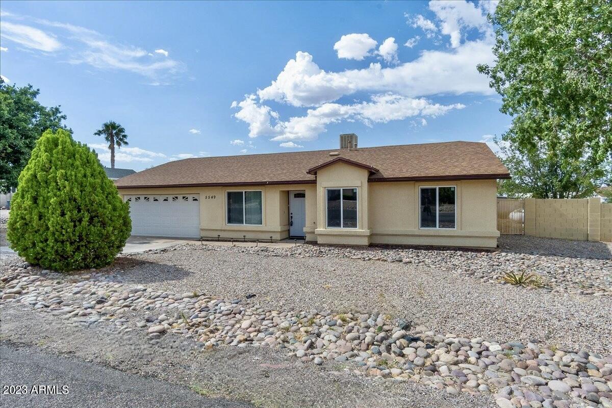 NEW FLOORING!!!! 3 bedroom, 2 bathroom site built home with a 2 car garage on a spacious lot that features mountain views! This one has lots to offer! Vaulted ceilings, updated kitchen (with soft close cabinets), new refrigerator, updated bathrooms, new water heater, new septic tank with risers, brand new windows throughout and new sliding glass door with built in blinds! Paved roads, no HOA, RV gate and plenty of room to park your RV, no well share. So much to love about this one! Come check it out!