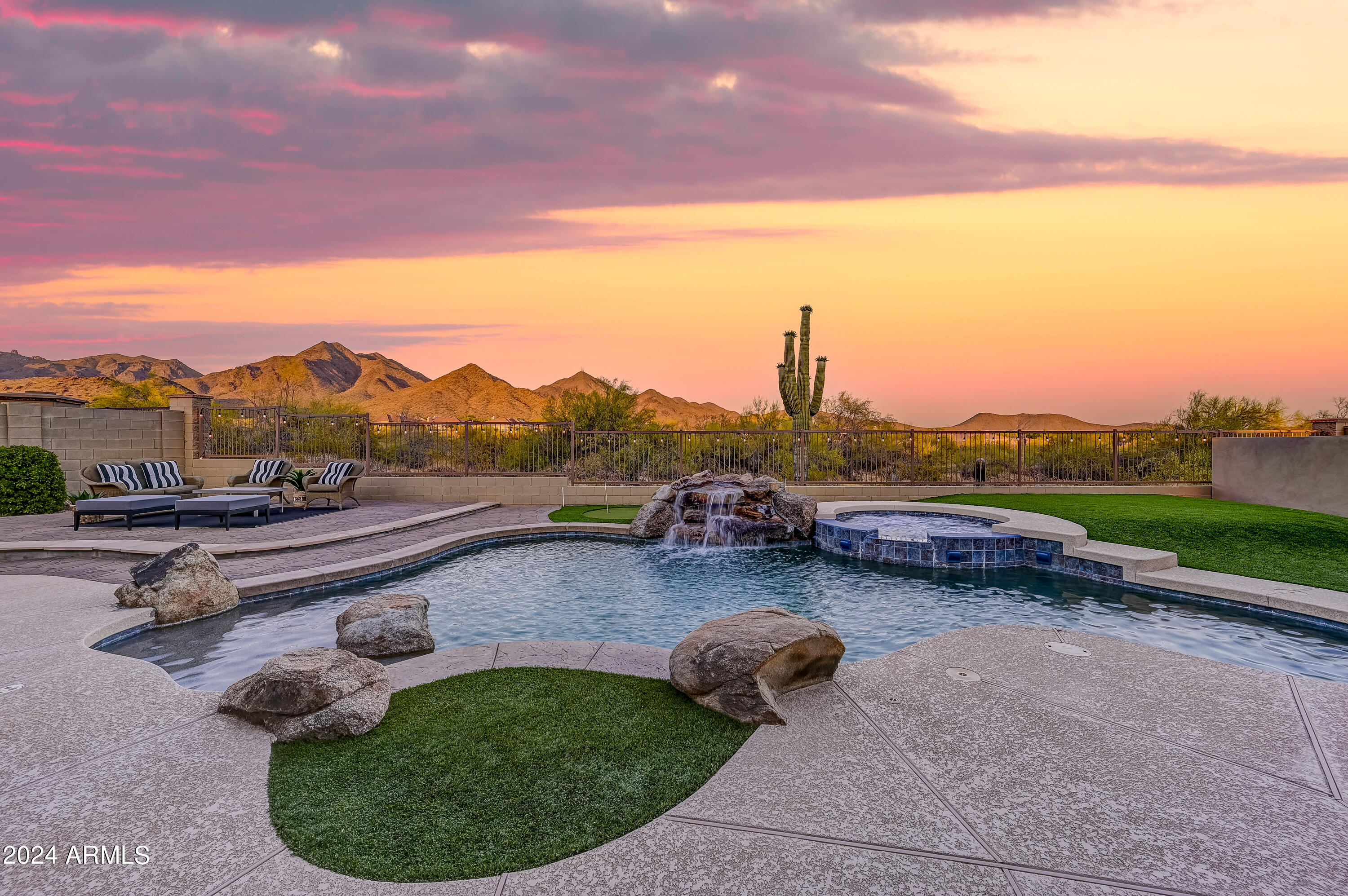 Discover unparalleled views in Windgate Ranch from this exceptional lot! Experience breathtaking vistas of the McDowell Mountains and invigorating sunrises in this expansive 4470 sq ft single-level residence. Seamlessly designed, the primary suite and spa-like bath are intelligently positioned adjacent to a versatile office or workout space. Two additional ensuite bedrooms and a commodious flex area flow into the grandeur of the great room, featuring a formal dining cove, a cozy fireplace, and multiple conversation nooks. The kitchen boasts ample storage, including a convenient walk-in pantry. Attached is a casita offering yet another bedroom, bath, and walk-in closet. Step outside to your private backyard oasis, where unobstructed views of the McDowell mountains and Tom's Thumb await. Entertain effortlessly with a covered patio and built-in barbecue, perfect for gatherings and family time.

Enjoy the abundant amenities of the community, from scenic walking trails to tennis and pickleball courts, sand volleyball, three pools and spas, playgrounds, picnic spots, and an open-air community center. Experience the convenience of McDowell Mountain hiking at Gateway which is just across the street, while golf courses, shopping, and dining options are all within close reach along with the nearby 101 freeway.
