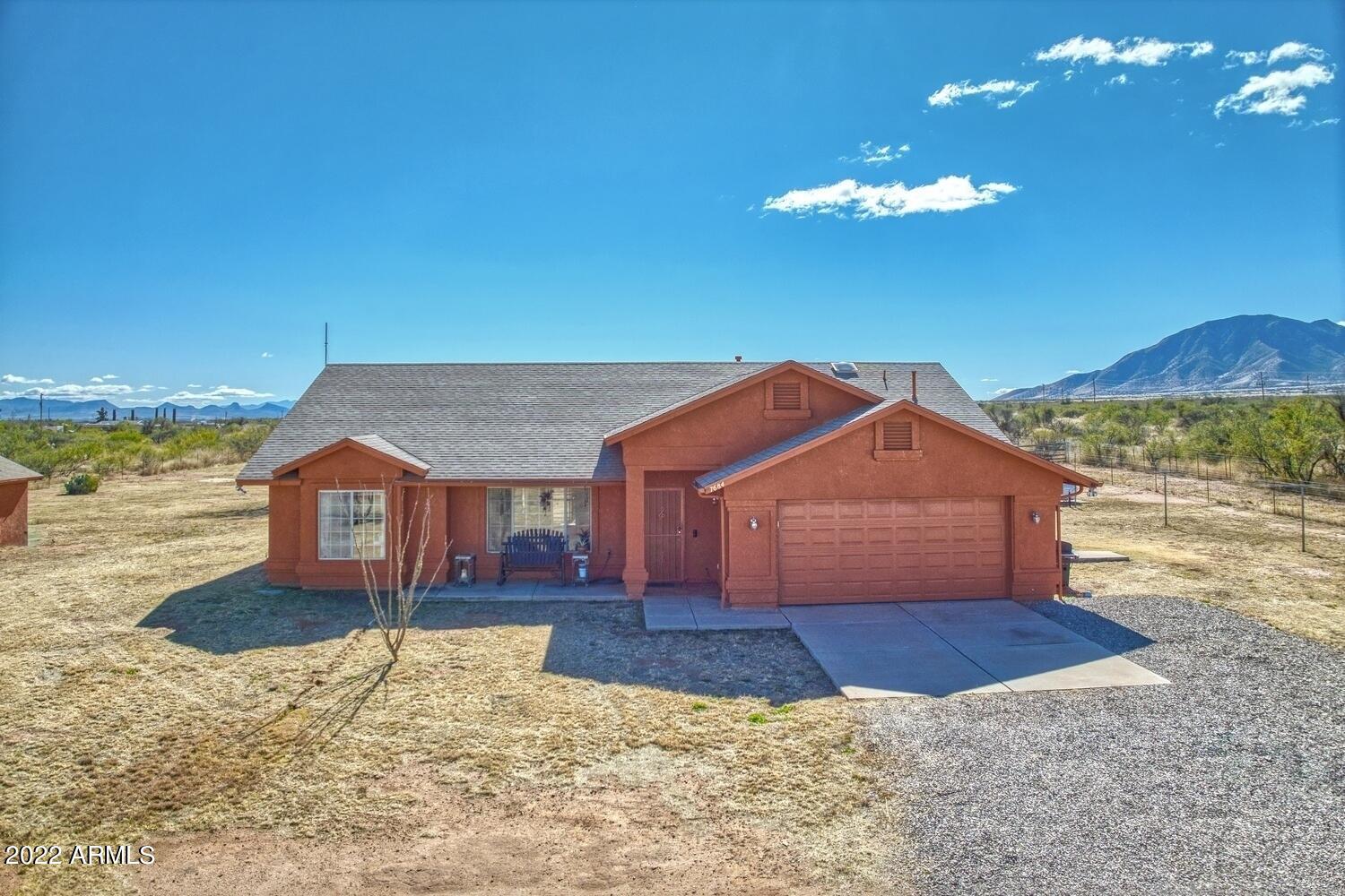 What a find!!  3 bedroom 2 bath split floorplan with an office on 4 acres of unobstructed views of the Huachuca's!  This home is everything you could want.  Plenty of space for chickens, horses, or just stargazing.  The property boasts a private well, new exterior paint, newer roof, newer appliances and hard flooring throughout, raised garden beds, a gorgeous Sahuaro Cactus, fully fenced and gated, plus it's right off Moson Rd.  This one won't last long!  Come see for yourself and fall in love with this beautiful property.