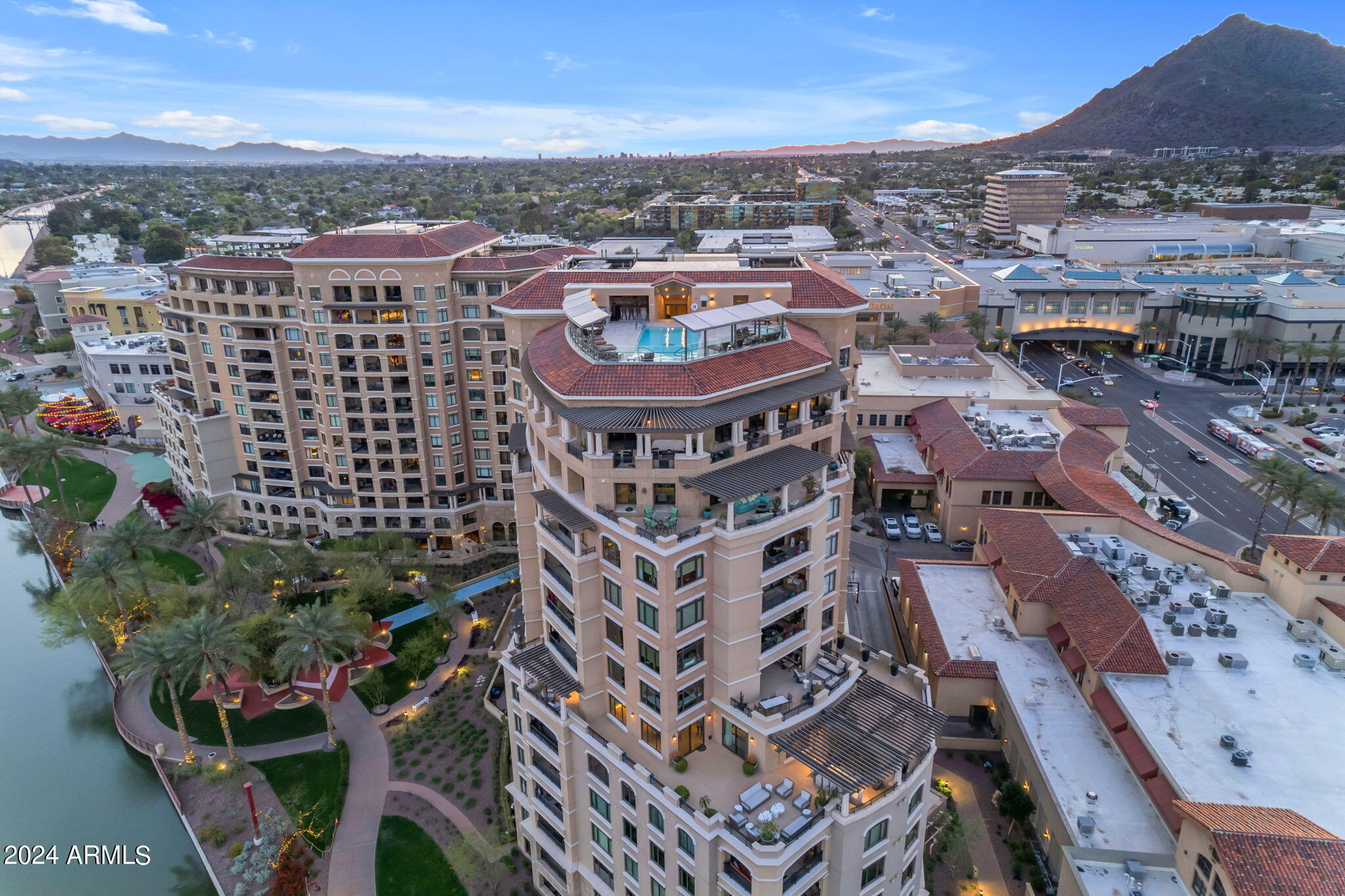 Indulge in the epitome of luxury living in one of the most RARE units at The Waterfront high-rise condos offering a 1400 sq. ft. patio, a haven for entertainment & relaxation & VIEWS!  Located in the vibrant heart of Scottsdale's iconic Old Town, WALK to dining & shopping, w/ Fashion Square Mall & upscale boutiques just steps  from your doorstep. This meticulously crafted condo boasts high level finishes throughout, a spacious kitchen w/ top-of-the-line appliances & an expansive long Island. Experience unparalleled amenities within the community, including a grand clubhouse, a heated rooftop pool &  spa, & fully equipped fitness center, 24/7 concierge & valet parking & more! Complete w/3 PARKING spaces & 2 storage units. FURNISHINGS INCLUDED!  It's a true luxury lock & leave  lifestyle!
