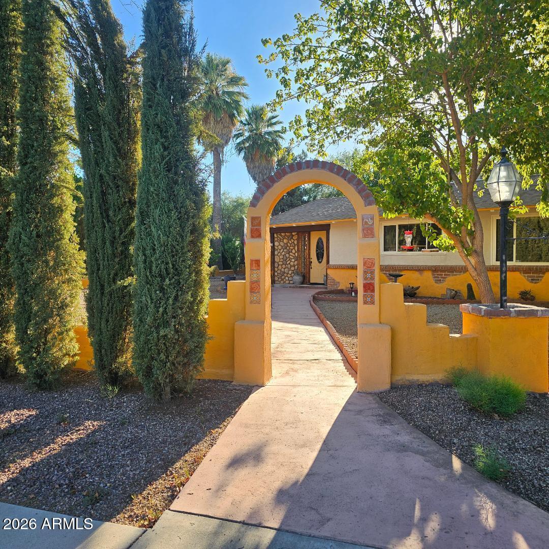 Come take a look at this BEAUTIFUL home! No HOA! Perfect for a large family or Airbnb. Close proximity to downtown. 4 bedrooms, 3 full bath. Large Mother-n-law suite w/ oversize bathroom, walk-in closet and separate exit to backyard. Relax in your family room by a beautiful rock fireplace. Gourmet kitchen with an abundance of cabinets & granite counters. Enjoy the Arizona room, fully enclosed w/ a built in bar and lots of room to entertain. Enclosed backyard, raised garden beds in your very own garden area. Storage shed.  Mature landscaping.