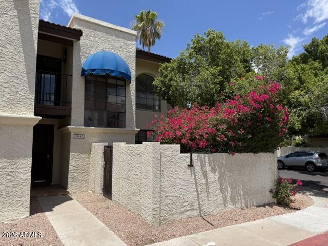 Experience timeless Southwestern charm in the highly sought-after Pointe South Mountain community! This inviting 2-bed, 2-bath townhouse is nestled on a desirable corner lot surrounded by lush, park-like grounds, mature shade trees & scenic walking paths. Inside, you'll find an open floor plan w/inside laundry room plus a convenient bath on the main level. Enjoy your private courtyard & covered patio--ideal for relaxing or entertaining. Upstairs, both spacious bedrooms feature ample closet space & their own private balconies. Home includes an assigned covered carport with direct access through the laundry room. Rent includes water and trash service. Residents enjoy resort-style amenities including heated pools, spas & beautifully maintained landscaping that creates a peaceful retreat. Conveniently located w/easy access to major freeways, shopping, dining, golf, hiking & South Mountain recreation, this home offers the perfect blend of comfort, convenience