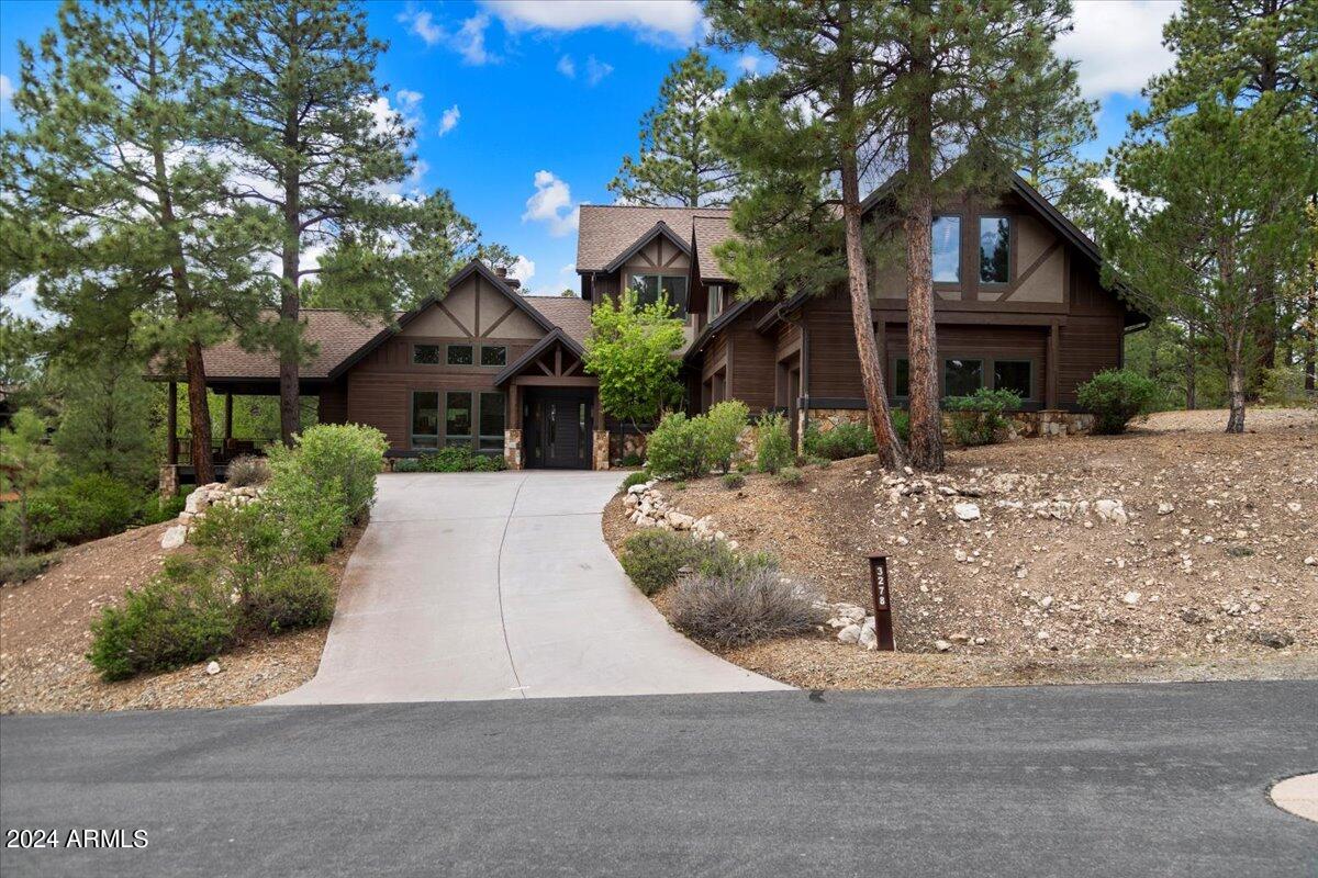 Pristine Pine Canyon home. Recently updated kitchen features double ovens, stainless steel appliances, granite countertops, breakfast bar, bar area, and walk-in pantry. Primary bedroom on main floor with recently updated bathroom featuring large walk-in shower, separate soaking tub and double vanity. Additional ensuite bedroom on main floor that also would make a great office. Two large bedrooms upstairs, one is an ensuite. HUGE upstairs bonus room. Two outdoor trex decks ideal for outdoor living and entertaining. Deck off kitchen has built in BBQ, pizza oven, griddle, rotisserie, and marble counter tops. There is also a private patio off primary bedroom. Living room with gas fireplace and large windows to enjoy the views. This is a must see.