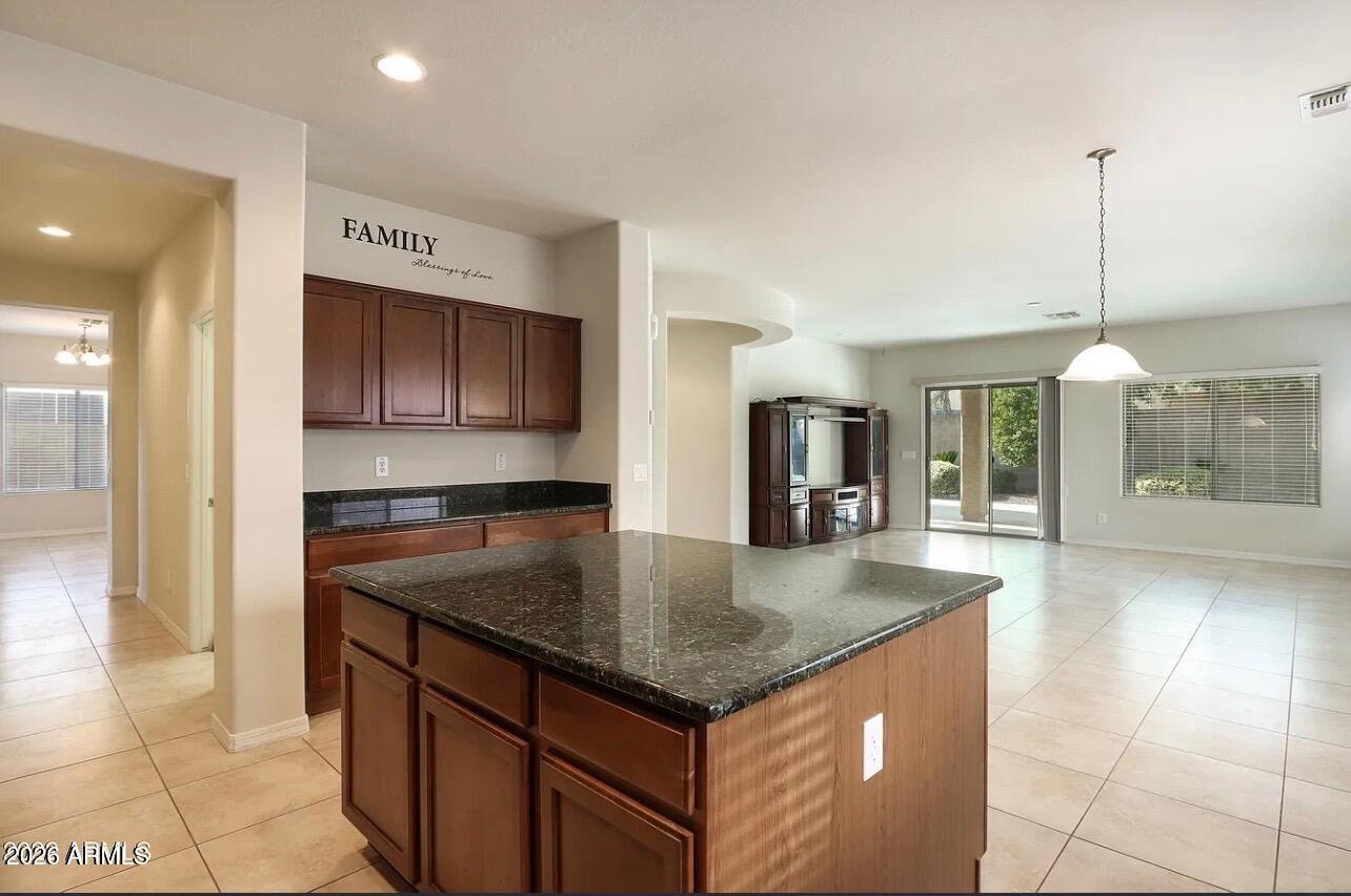 Home at last, this spacious 5 bed 3 bath home offering over 4000 square feet of comfortable living space can accommodate any family. Well maintained kitchen features granite countertops, brand new fridge and dishwasher, reverse osmosis, a walk-in pantry and gas stove. Oversized bedrooms all have walk in closets, and there are three great entertaining areas a family room with built in surround sound, loft and formal living room Outdoor firepit and built in BBQ. add to this homes value. 3 car garage with Tesla charger, has plenty of room for vehicles and toys. The community offers so many amenities for you to enjoy. Landlord will pay HOA Dues, and pest and landscaping come quarterly. Community Amenities include parks, pool, walking trails, golf courses, and fitness facilities.