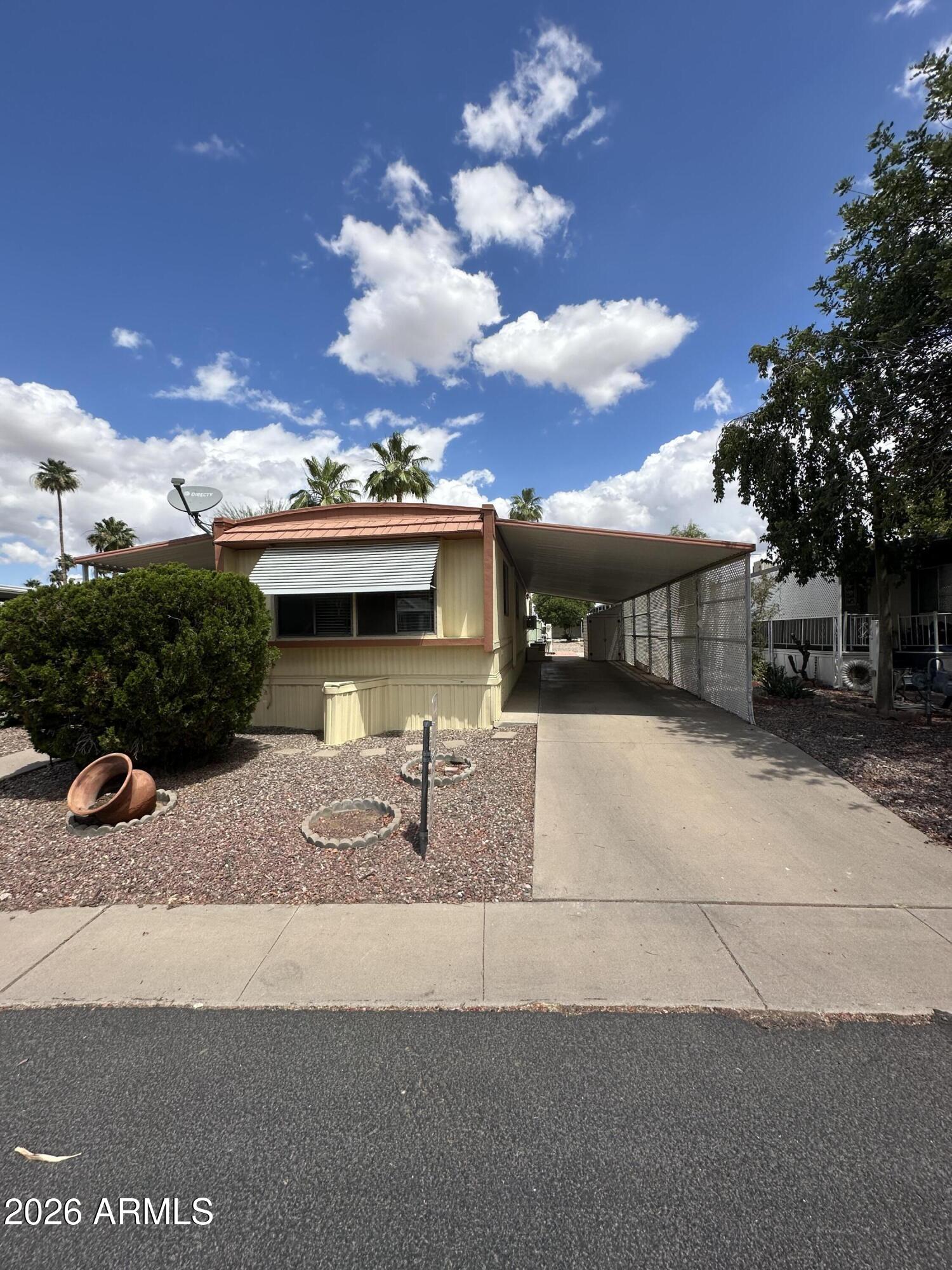 Welcome Home to the 55+ gated community of Cielo Grande in East Mesa. Come see this charming 2 bed, 1 bath home with over 800 sq ft. Large master bedroom and oversized living area. Gas stove and stainless steel fridge and sink. This great community has a club house, work out area, pool, spa, shuffle board, and more. To Show Is To Sell!