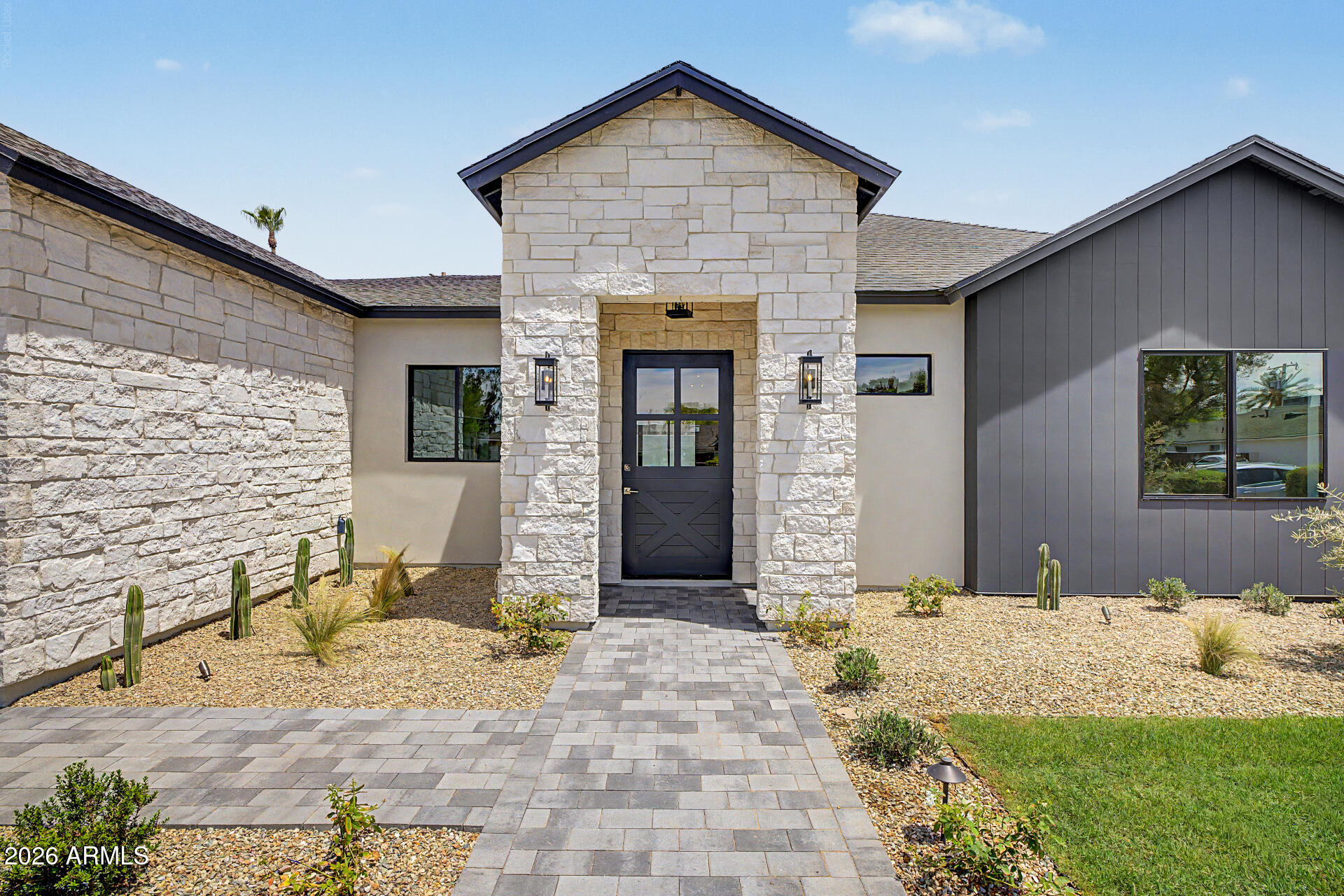 Experience luxury living in the heart of Biltmore Heights! This stunning new construction offers 2,950 SF with 4 bedrooms, 3.5 bathrooms, and an oversized 2-car garage. Soaring 13' ceilings throughout and a vaulted great room create an open, light-filled design. The chef's kitchen features Taj Mahal quartzite countertops, custom crema cabinetry, and a striking custom roman clay hood. Wood and porcelain tile flooring, a split floor plan, a private primary suite with spa-inspired bath, and walk-in closets in every bedroom provide comfort and style. Enjoy a covered patio with built-in BBQ, security system with cameras, north/south exposure, and breathtaking mountain views.