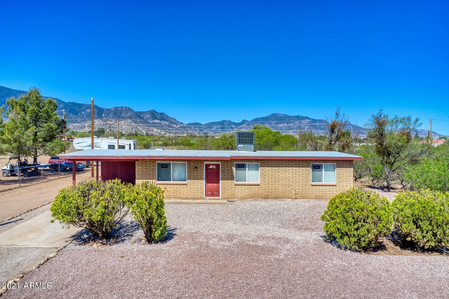 Tastefully remodeled  3 Bedroom, 2 bath on 1 acre of land with mountain views.  Rural living but still in town.   Kitchen has granite countertops, and beautiful tile backsplash, bathrooms have gorgeous quartz and tile, ceiling fans throughout , central air, durable and moisture resistant vinyl plank flooring and much more.  Check it out at your earliest convenience.  Owner/Agent