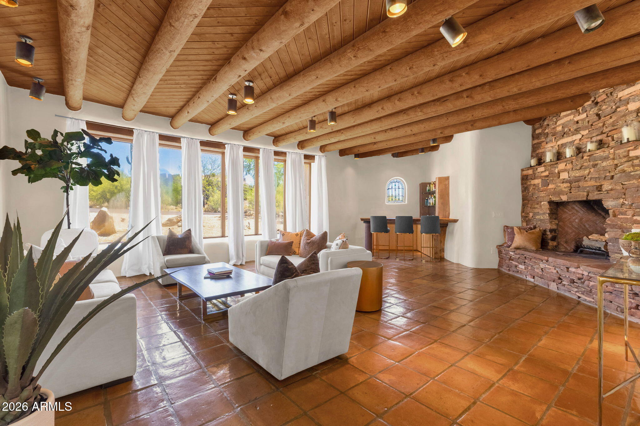 Experience timeless Southwest charm in this Santa Fe Territorial home nestled on 1.6 acres in the sought after Carefree Foothills subdivision. This 3 bedroom plus den/office, 3 bathroom retreat features authentic character throughout with warm wood ceilings, 4 fireplaces, exposed posts, and Saltillo tile flooring. Enjoy breathtaking mountain views and sparkling city lights from the view deck in this private desert setting. The spacious floor plan blends comfort and style, creating the perfect Arizona escape for year round living or a seasonal retreat. New roof completed in 2026. A rare opportunity to own a true desert sanctuary with classic architectural appeal and unforgettable views in the heart of Cave Creek. Furnishings available under separate bill of sale.
