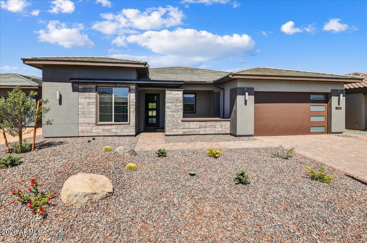 Brand-new Cordoba on a premium homesite in Trilogy at Verde River! This thoughtfully designed split great-room floorplan offers 2 bedrooms, a den, and 2.5 baths with designer upgrades throughout. The gourmet kitchen features a JennAir built-in refrigerator, upgraded cabinetry, and premium finishes, while the stunning wine room adds a touch of sophistication. Retreat to the luxurious primary suite with a bay window, quartz shower bench, and quartz tub deck. Upgraded flooring, framed mirrors, 4'' garage extension, custom landscaping, and an oversized easy-care backyard complete this exceptional home. 
The amenities at Verde River are World Class with Tom Lehman inspired eighteen-hole Golf course, tennis courts, 12 pickleball courts, and bocce ball, heated lap pool and Resort style swimming pool, hot tub, Afterburn fitness center, Helen's demonstration Kitchen for cooking classes and a 7.5 acre dog park. The community center has casual poolside dining at Eddy's Diner and gourmet dining at award-winning Needle Rock Kitchen and Tap, Alvea Spa with full-service Salon and Spa amenities, Art Loft and events center. Trilogy at Verde River is adjacent to the Tonto National Forest and is situated in the middle of miles and miles of hiking and biking trails.