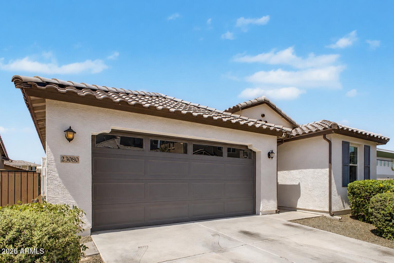 Experience modern luxury in this 2022-built home situated on a premium corner lot. This open-concept floor plan features 4 spacious bedrooms plus a versatile den and 3 full bathrooms, highlighted by elegant tile flooring and sleek stone countertops.
The home's interior transitions perfectly to a spectacular, professionally landscaped backyard designed for entertaining, featuring high-end pavers and pristine synthetic turf. With its prime location and designer finishes, this nearly-new residence offers the perfect blend of style and sophistication. Move-in ready!