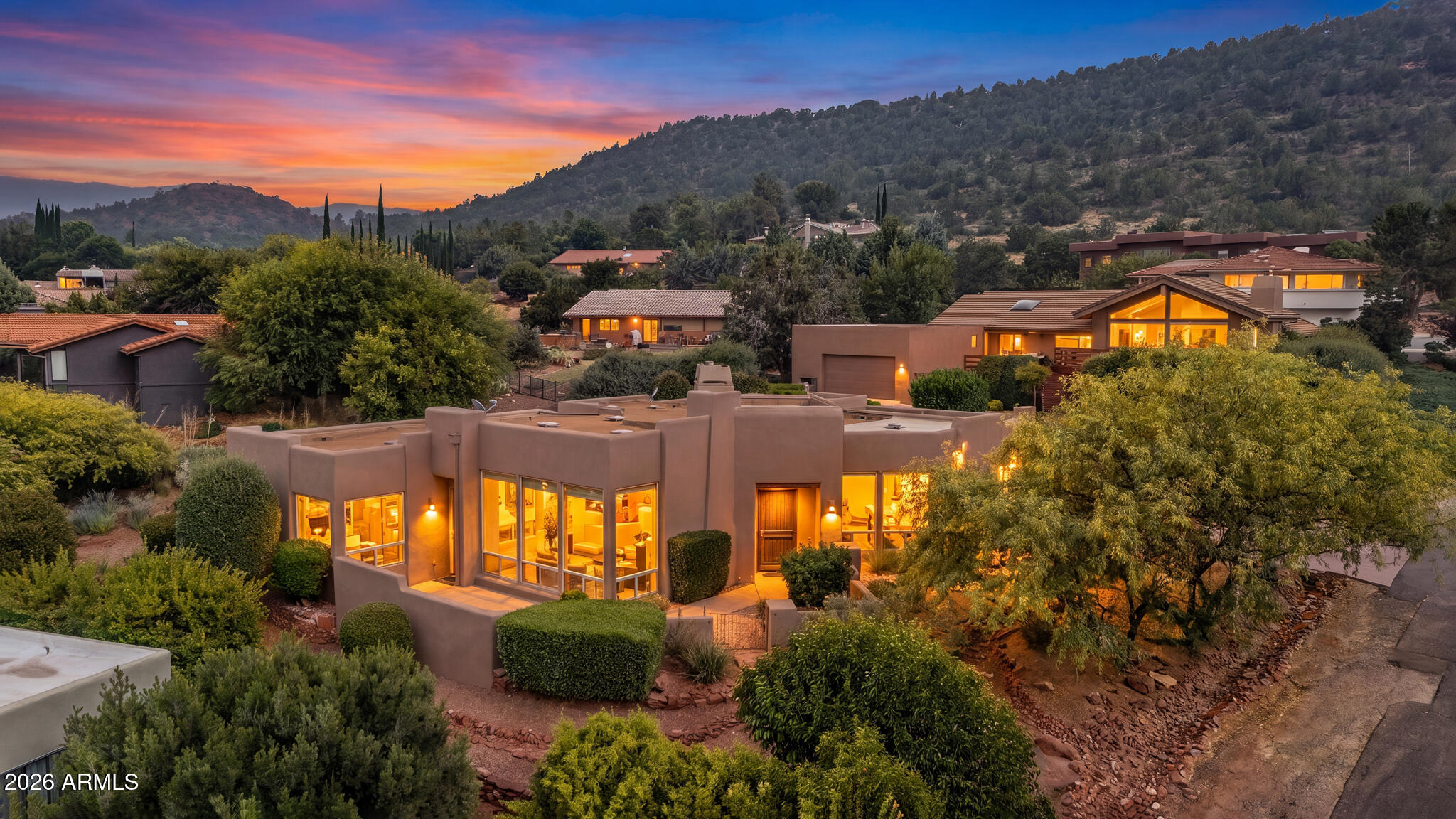 Located in the desirable Saddlerock Homes neighborhood with no HOA, this beautifully maintained 3BR/2.5BA residence offers panoramic red rock views of Thunder Mountain, Chimney Rock, Coffee Pot Rock, and more. The open floor plan features a spacious great room with soaring ceilings, a fireplace, and floor-to-ceiling windows framing Sedona's iconic scenery. The gourmet kitchen boasts granite countertops, a large island, custom cabinetry, stainless steel appliances, gas cooking, and a wine fridge. A split floor plan provides privacy for the primary suite, complete with a spa-inspired bath. Additional features include a new HVAC, water softener, bonus/flex room, custom built-ins, and designer finishes. Enjoy spectacular views, colorful sunsets, and an exceptional West Sedona location near shopping, dining, galleries and world-class hiking and biking trails.