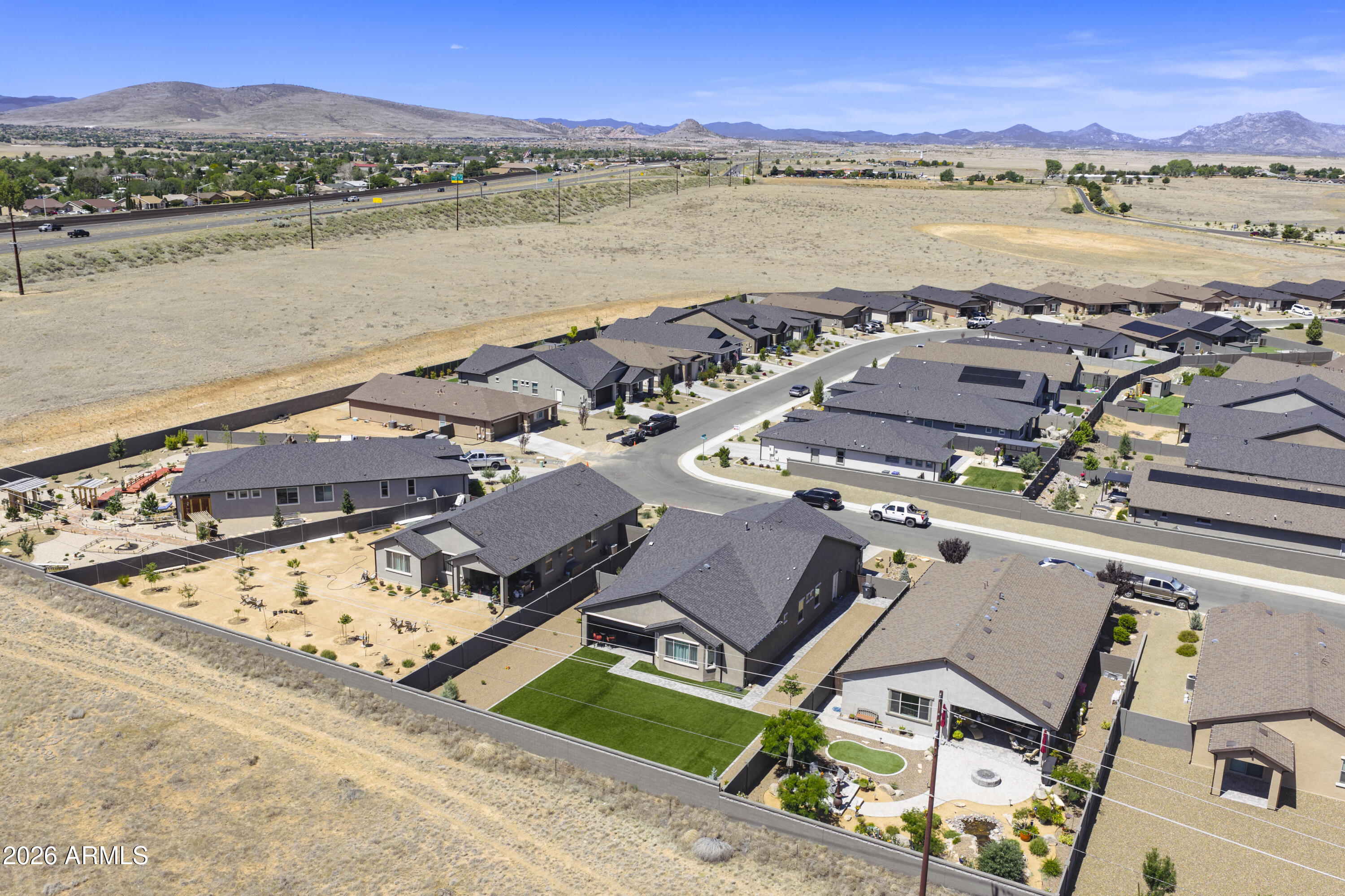 This beautifully designed home blends superior craftsmanship with modern finishes and sweeping mountain views, all set on an oversized lot backing to open space. Inside, the open concept layout showcases a spacious great room with a cozy fireplace, a chef's kitchen featuring granite countertops, stainless steel appliances, and an upgraded butler's pantry. The formal dining room offers the perfect setting for gatherings and entertainment.
The primary suite is a serene retreat with a spa style bathroom, a generous walk in closet, and direct access to the covered patio. Outdoor living shines here -- relax beneath the extended patio while taking in the stunning Mingus Mountain views. The expansive backyard features plenty of turf, low maintenance landscaping, and ample room to enjoy Prescott Valley's sunny days and cool evenings.
With thoughtful design, upgraded features, and a prime location near parks, trails, and Hwy 69 & 17 for commuters, this is truly the one to buy.