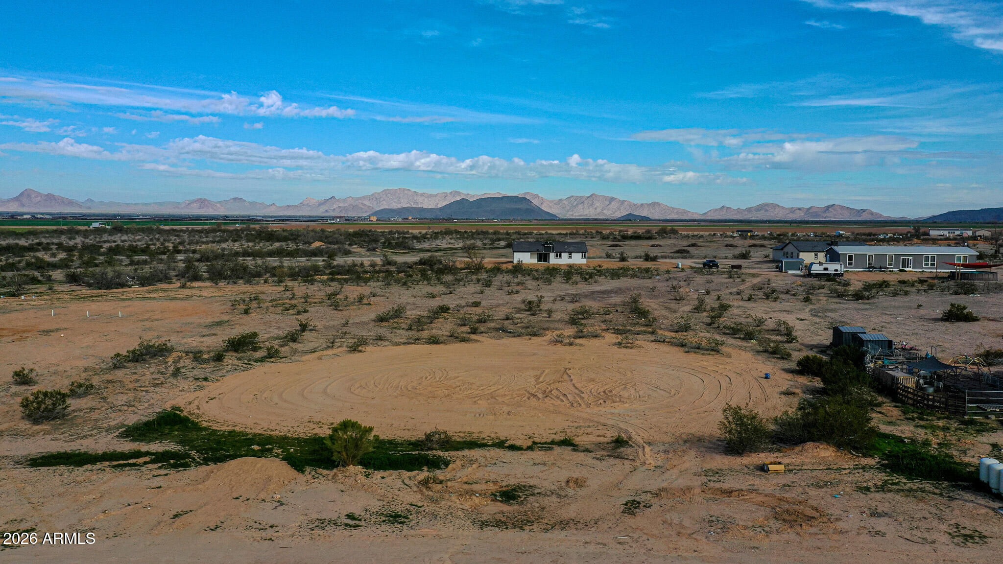 Build your dream in wide-open Arizona desert with this 1.2-acre vacant lot located in Coyote Ridge in Tonopah. Positioned between two established homes, this parcel offers a clear and practical homesite with infrastructure already nearby.The property is on a shared well with three other properties, helping reduce the cost of development. Electricity is close by, making it easy for a buyer to pull power for a future build. Whether you're planning a manufactured home or a site-built (stick) home, this lot offers flexibility and space to create exactly what you want. Enjoy expansive desert and mountain views, plenty of room for toys, animals, workshops, or RV parking, and the peace that comes with wide open land while still being within reach of the West Valley.