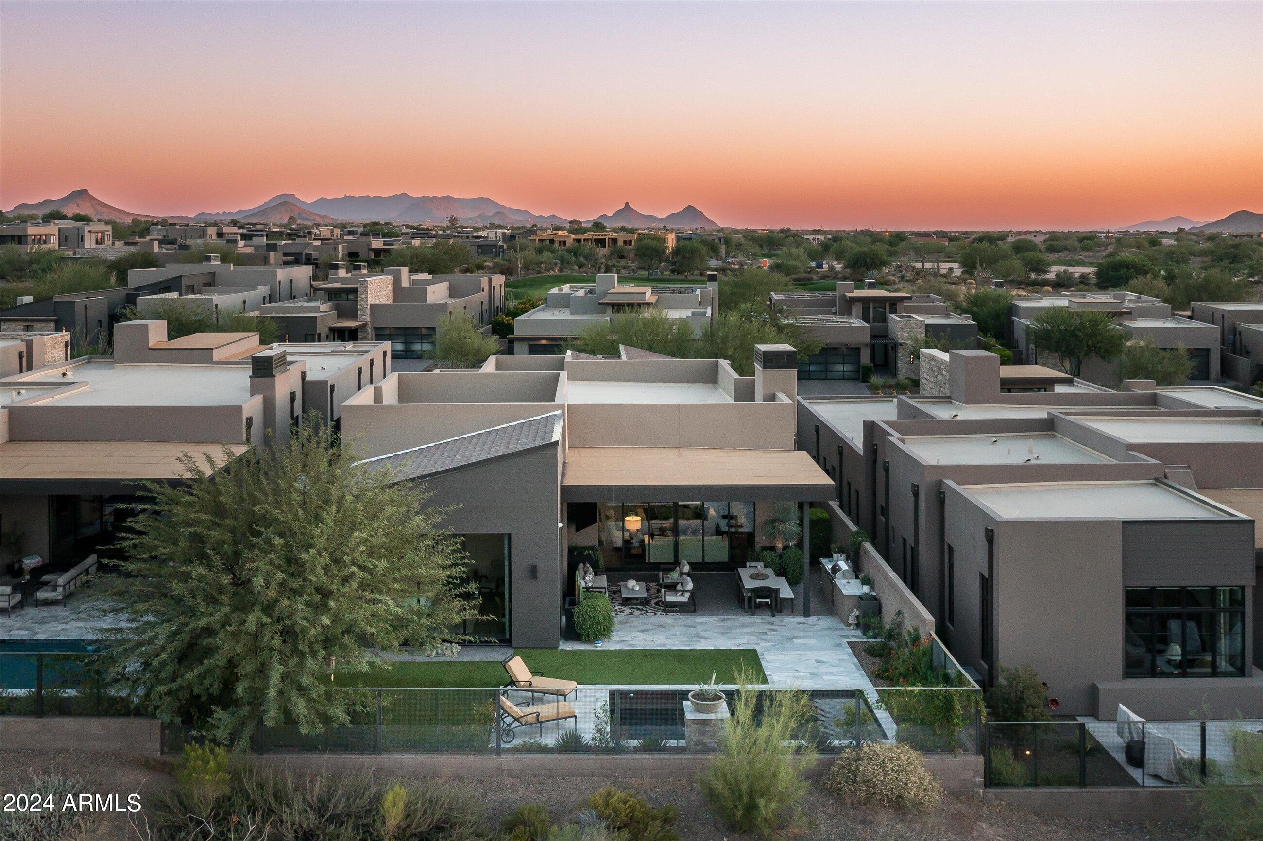 Welcome to this stunning contemporary Camelot golf villa in the exclusive subdivision of SEVEN at Desert Mountain, where luxury meets the seductive beauty of the Sonoran Desert. This property is a golfer's dream, boasting membership to the ultra-prestigious Desert Mountain Golf Club. Nestled by the 12th fairway of the 7 Course, this exquisite home offers captivating views and privacy. As you step through the front door, the vastness of the great room invites you in, showcasing lush golf course vistas which are mirrored in the opulent patio space. Thanks to the innovative telescoping doors, transitioning from the grand interior to the sublime outdoors is seamless, epitomizing the Arizona indoor-outdoor living experience. Elegance resonates throughout the residence with hardwood floors and a host of tasteful upgrades. The gourmet kitchen is a chef's delight, featuring state-of-the-art WOLF appliances set against contemporary fixtures, and complemented by gorgeous quartzite countertops that is both stylish and functional.
The villa bathes in natural daylight, creating an ambiance of warmth and welcome in every room. Tastefully decorated, the interior color palette is composed of neutral tones that exude sophistication, offering a serene canvas for personalization.
Stepping outside, the resort-style patio is an entertainer's haven. Complete with a built-in barbecue, a heated spool, it's the perfect backdrop for enjoying the spectacular Arizona sunsets. This property isn't just a home; it offers a lifestyle encompassing luxury, comfort, and the rarified air of the exclusive golf community. With beautiful landscaping framing this architectural gem, every aspect of this villa has been curated to offer an unparalleled living experience.
Don't miss the opportunity to own this slice of desert paradise, where every day feels like a vacation at a world-class resort.
Furniture available under a separate agreement.