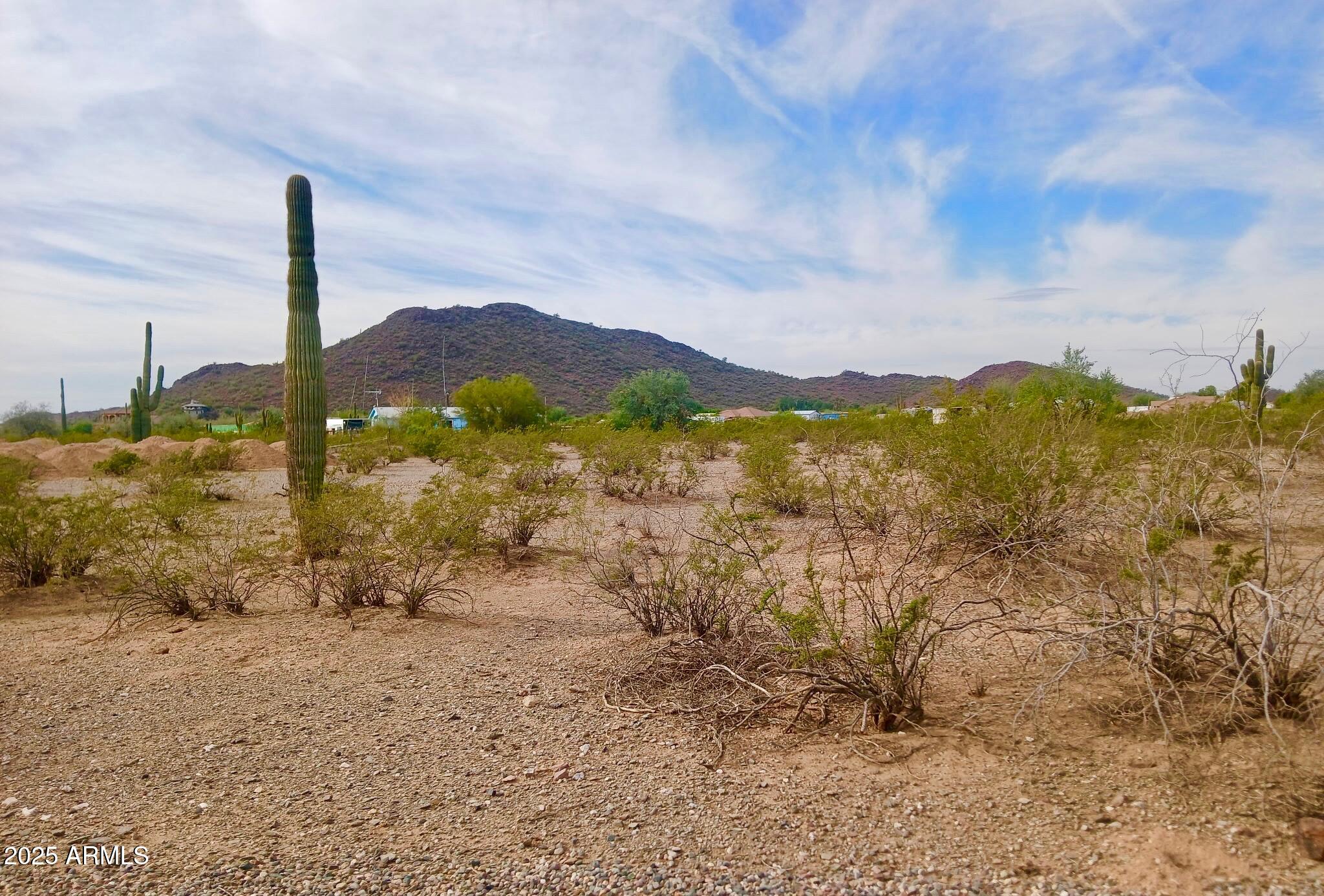 Discover the perfect opportunity to build your dream home on this beautiful 1.5-acre parcel in the heart of a rapidly growing area of Surprise. Nestled just off Dynamite Boulevard and conveniently located near North Peoria, this highly sought-after area offers an ideal blend of tranquility and accessibility.
This property comes with several ready-to-go features: it includes a shared well, power access. Plus, the groundwork is already done with dirt brought in for your building pad, making it even easier to start your construction. Enjoy unbeatable views and a serene environment that truly stands out in this up-and-coming neighborhood. This parcel is a rare find and a fantastic canvas for your custom home.  Power and water will be stubbed to parcel.