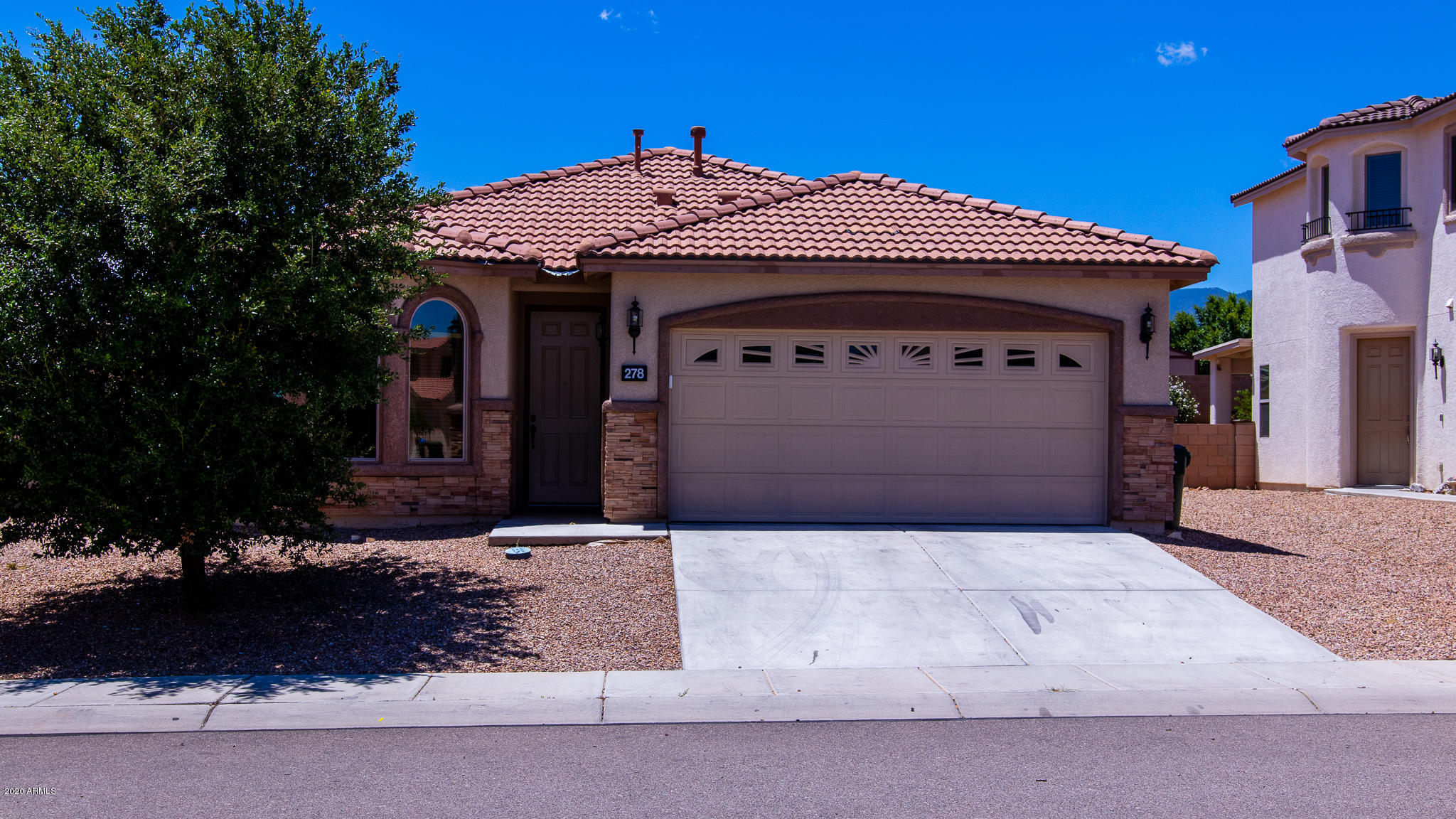 Don't miss this this beautifully upgraded RL Workman home! Energy Star and Environments For Living Certified Home for guaranteed utility bill savings! Spacious kitchen features granite countertops, upgraded hardware, maple cabinets, and stainless steel appliances. Ceiling fans installed at Master and Living rooms, prewires in all other bedrooms. Beautifully tiled in common areas with carpet in bedrooms. Master Bathroom features granite vanities with dual sinks, large tile surrounds with decorative inlay, and oversized garden tub.  Interior also features recessed lighting, laundry room cabinets, custom wooden blinds, huge pantry/storage closet and bay windows. Low maintenance landscaping and custom paved backyard  and drip irrigation. Minutes away from Ft. Huachuca.  Don't wait! Call TODAY!