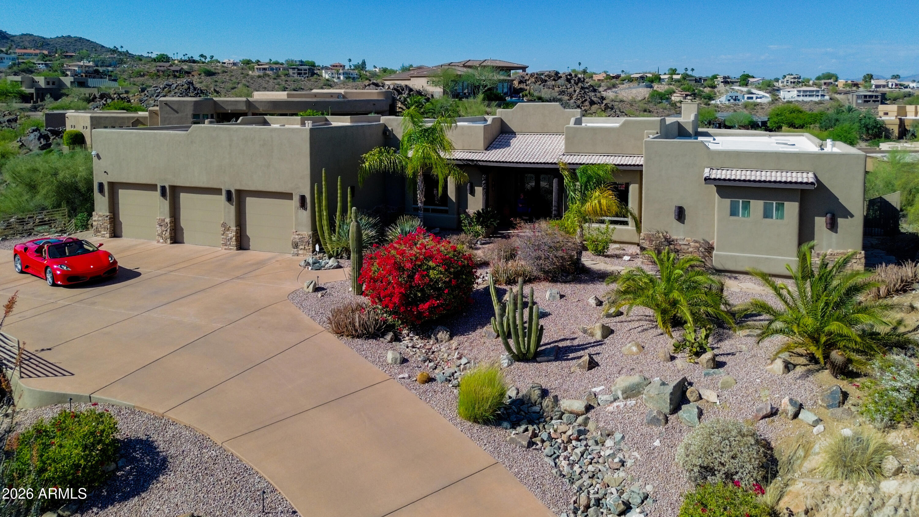Perched atop 1.103 acres, Stone Ridge Estate offers breathtaking 360° mountain views including Four Peaks, stunning sunrises, sunsets, and star-filled skies. Built by Echelon Fine Homebuilders, this luxury estate features travertine floors, wood columns w/stone accents, shutters throughout, & a dramatic stone fireplace. Chef's kitchen boasts Viking appliances, granite counters, & a large oval island. Spacious primary retreat offers oversized walk-in shower & custom closet. Other bedrooms include ensuite baths w/ dual sinks. Entertainer's bar w/sink, ice maker, and 226-bottle temperature-controlled wine cellar. Resort-style backyard features heated pool/spa, fire pit, outdoor shower, Grand Turbo Grill, Smoker/BBQ, authentic Italian pizza oven, and more. Oversized cooled 3-car garage Fountain Hills, AZ attracts homebuyers with its quiet, scenic atmosphere, featuring stunning McDowell Mountain views, the iconic 560-foot fountain, and a top-tier "Dark Sky" designation for stargazing. Buyers are drawn to the outdoor lifestyle, including extensive hiking trails at Adero Canyon, championship golf, and proximity to Saguaro Lake.

Perched high atop its own private hillside, Stone Ridge Estate offers a rare opportunity to live like royalty surrounded by breathtaking 360-degree mountain views stretching across four peaks. From unforgettable sunrises and fiery Arizona sunsets to moonrises over Four Peaks and incredible star-filled skies, this extraordinary estate delivers a truly unmatched lifestyle.

Crafted by Echelon Fine Homebuilders, this architectural masterpiece showcases exceptional craftsmanship and luxurious Southwestern elegance throughout. Rich travertine and wood flooring, dramatic wood columns with stone accents, custom shutters, and a stunning stone fireplace create warmth and sophistication. Designed for entertaining on every scale, the grand dining room easily accommodates large gatherings while the distinguished chef's kitchen impresses with a magnificent oval island, granite counters, and a full Viking appliance package.

The luxurious primary retreat offers a spa-inspired oversized walk-in shower and custom walk-in closet. Each additional bedroom features its own ensuite bath with dual sinks, providing comfort and privacy for family and guests. The entertainer's bar includes a sink, ice maker, and a 226-bottle temperature-controlled wine cellar.

Resort-style outdoor living reaches another level with a heated pool and spa featuring Pentair ScreenLogic controls, outdoor shower, expansive patios, large gas fire pit, and one-of-a-kind outdoor kitchen complete with 10 burner Grand Turbo Gas Grill and side burner, Separate BBQ/smoker,  and an authentic Italian pizza oven. Whether hosting unforgettable gatherings or enjoying peaceful evenings under the stars, this backyard is truly exceptional.

Additional highlights include an oversized evaporative-cooled 3-car garage and a new roof completed in 2025. Simply fabulous in every way, Stone Ridge Estate is luxury desert living at its finest.

Full roof recoated in 2025.