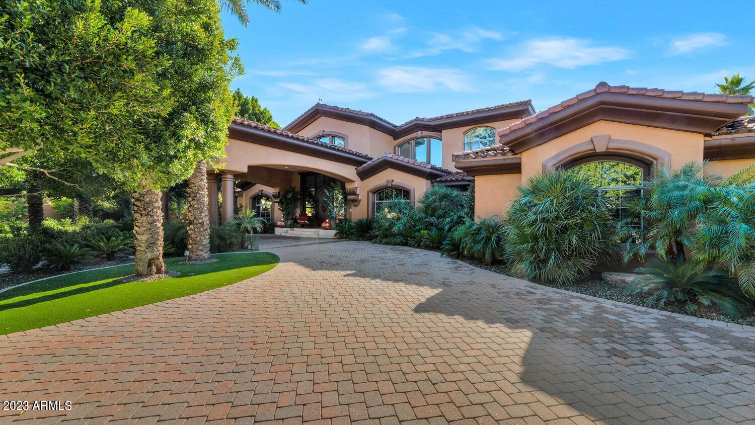 This lavish estate is so elegant, so stylish and so impressive. From the moment you enter through the grand foyer, you'll appreciate the impeccable attention to detail and the quality craftmanship at every turn. The custom finishes are too numerous to mention and seamlessly flow from room to room. The gracious living spaces include formal and informal great rooms, a beautiful dining room, custom study/office that will make working from home a pleasure, a billiards room, and a magnificent chef's kitchen with top-of-the-line appliances and double islands offering more than enough room to prep, serve and entertain. All the bedrooms and bathrooms are perfect, there are numerous custom fireplaces inside and out, and the unique millwork, lighting, fixtures and cabinetry are simply exquisite. Sitting on an acre of land, the lushly manicured grounds include a stunning pool and spa, full outdoor kitchen and dining gazebo, huge bar, putting green, sport court, water features, fabulous verandas and huge covered patio areas. The home is gorgeous, and the setting is exquisite. An added bonus is there is an adjacent property available as well, for those who may be looking to create a high-end family compound or corporate retreat. This is a very special opportunity in an excellent location!