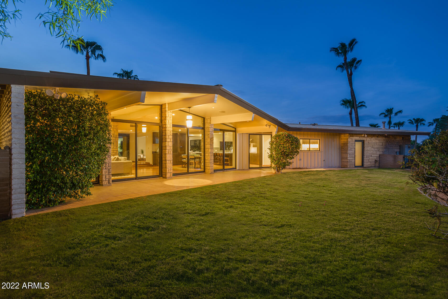 Incredible Mid Century Modern house gets FULL 'down to studs renovation' saving great architecture, rooflines & history for another 100 years! With Texas Limestone, Walnut Floors, Metal Roof, Fleetwood Windows & Doors, Raised Ceilings, ALL En-Suite Baths, Sub-Zero and Wolf well ... everything & room for 6+ cars or Guest House in lower building that is 1200SF alone. This NEW house is now a perfect MODERN HOME. An acre and a half in Paradise Valley proper right on the side of Camelback Mtn with Mountain View's from each window. The collaborative team includes: Kent Architects, Bent Nails, and The Refined Group to take Jim McGrath's 1965 gem with iconic gabled roof and clerestory windows on Sage Drive to a whole new level. See supplement for the MANY upgrades to this classic home. SEE MORE .. Features:  
Fully Renovated down to studs Mid Century Modern
Mountain Hillside Home 
Views everywhere Camelback to McDowell's
Acre and a half of PV proper living
Upper attached 2 car garage, lower detached 4 plus car garage
Lower building is 1200 SF and could easily convert to a Guest House
Storage Galore everywhere
4 bedrooms all en-suite, all good sized with walk-in closets
Massive Owner's Suite with yard access and jetted tub
All closets, pantry, laundry built-out by California Closets
Builder Jim McGrath built Rolling Hills  - 25 Homes up Sage Drive
Built in 1965, only 2 owners in life of home
Fully Permitted Renovation in 2011 and updated Kitchen in 2020
Walls Removed, Ceilings Raised, Electric/Plumbing Pulled
Top Notch Renovation Team - see below
Architecture:  Kent Architects, Greg Kent 
Builder:  Bent Nails, Inc. - Paul Haynie
Interior Design:  The Refined Group, Dana Lyon
Design inspiration:  Bali Residence in Wayzata Minnesota by architect Charles Stinson, who consulted on the Sage Dr. project as well as considered Frank Lloyd Wright his main influence
Texas Limestone throughout on Walls and Bath Floors
Walnut Flooring throughout entire home 
Fleetwood Doors and Walls of Windows
Crestron Smart Home throughout
Entire home is wired in Cat 5e cable for data & security
Stubbed out cable ready to bring to Lower House
Full Security Systems, inquire for details
Three-Phase power to home and entire property w/ run to lower garage
Large power amps allow for expansion, guest house and pool
Trane HVAC's all 3-Phase units with electrostatic filters, under service & maintenance agreements (from 2011 and 1 condenser fan 2022)
Low utility cost due to overhangs, great windows, roof & insulation
Open Cell Spray insulation on all exterior walls and roof
Interior walls have fiberglass insulation for added noise reduction
Kitchen includes: Wolf 48" range dual fuel, Wolf hood, Sub-Zero refrigerator, Sub-Zero refrigerator drawers, (2) Bosch dishwashers, Wolf microwave drawer, Wolf warming drawer, Franke sinks, Axor pot filler, Reverse Osmosis system
Bar includes:  Sub-Zero Full Height Wine Refrigerator Column, Sub-Zero Refrigerator & Freezer Drawers
Yard:  Includes Mature Landscape, Incredible Views, Hiking from your backyard, Raised Garden Beds, Tons of parking/driveways, Lower Additional Building/Garage, Gas Stub for outdoor Kitchen
Bathrooms - Toto Toilets & Sinks, Hansgrohe Fixtures, Jacuzzi Tub in Owner's Suite
Many Eco/Green Features include:  Spray Foam Insulation on all Exterior AND Interior Walls for sound and energy insulation along with Thicker than standard Drywall 
Standing Seam New Metal Roof, Built for a Lifetime