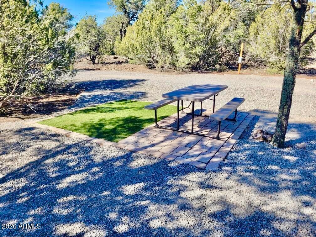 Nicely developed 2-Acre Property Just Outside Show Low - Ready for Your Retreat or Future Build! Escape to the cool mountain air and tall pines with this beautiful 2-acre parcel located just minutes outside of Show Low. Enjoy the peace and privacy of nature with a mix of mature junipers and pines, all with easy access via county-maintained roads MOST of the way. This property is already equipped for comfortable living or recreational use, featuring 200-amp electrical service with 50-amp RV hookup, 2-bedroom, 2-bath septic system already installed, 1,500-gallon water tank (water can be delivered or hauled). Whether you're planning to build your dream cabin or just need a weekend RV escape, the infrastructure is already in place. Located less than 5 miles from the local general store, gas station, mail services, bar & grillthis property offers both seclusion and convenience.
