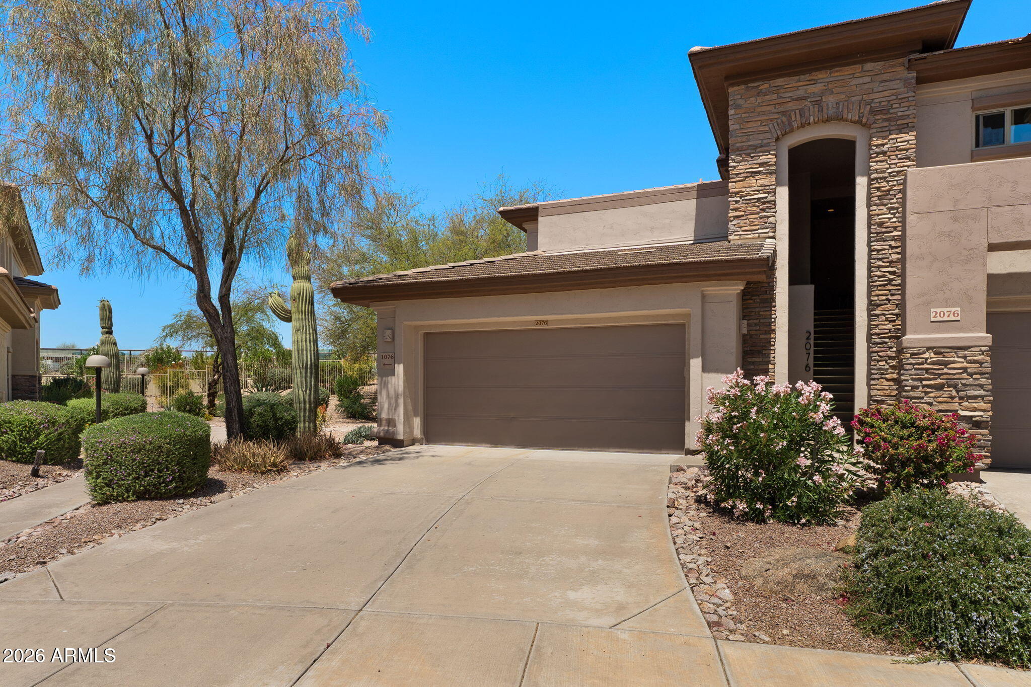 Experience easy luxury living in one of Fountain Hills' most sought-after gated communities! This light-filled 3-bedroom, 2-bath condo offers the perfect blend of comfort, convenience, and low-maintenance living--ideal as a full-time residence or a perfect lock-and-leave retreat for seasonal residents.

Inside, you'll find an open and airy layout with updated flooring and a spacious great room centered around a cozy gas fireplace. The kitchen offers plenty of space to cook and entertain, complete with beautiful granite countertops and ample cabinetry. Large sliding doors lead to an oversized private patio and balcony area, creating the perfect place to enjoy Arizona's gorgeous weather, whether sipping morning coffee or relaxing at sunset. Located just moments from Fountain Hills Fountain, downtown Fountain Hills, and the upcoming Fountain Hills Dark Sky Observatory, this home places you close to dining, shopping, entertainment, and community events. Residents also enjoy nearby access to the community center, library, gardens, and a renowned disc golf course.

The HOA covers key conveniences including exterior maintenance and more, making ownership simple and stress-free. Just minutes from Scottsdale and about 30 minutes from Phoenix, this location offers peaceful desert surroundings with quick access to city amenities.

A rare opportunity to enjoy security, scenery, and a vibrant community lifestyle all in one exceptional Fountain Hills property.