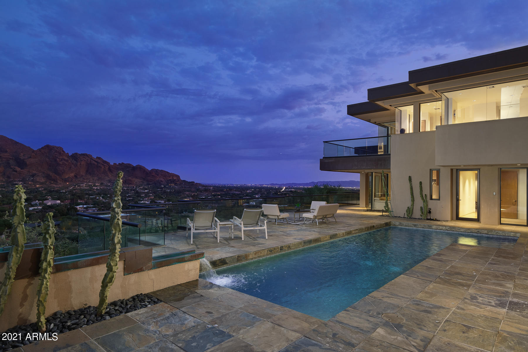 NOW IS THE TIME! Inspired by the Fibonacci Sequence - the Golden Ratio of Nature. Unobstructed, awe-inspiring Mountain & City views from every window of this beautifully crafted contemporary masterpiece. Privately gated & chiseled into the mountainside. Featuring 3 fabulous guest spaces which include an en suite Office/Conference Room, a dedicated en suite Guest Quarters, and an en suite Art Studio or secondary Guest Suite – all with their own breathtaking Mtn views.  A Snaidero Kitchen + Butler's pantry, exotic granite counters, beechwood floors, & ss appliances. Entertainer's dream, this multi-tiered design provides numerous venues for gathering & relaxing, w/ expansive covered patios & bar, 2 BBQs, exterior gas fireplace, pool, and a pvt. sunbathing deck. Rebuilt in 2002.