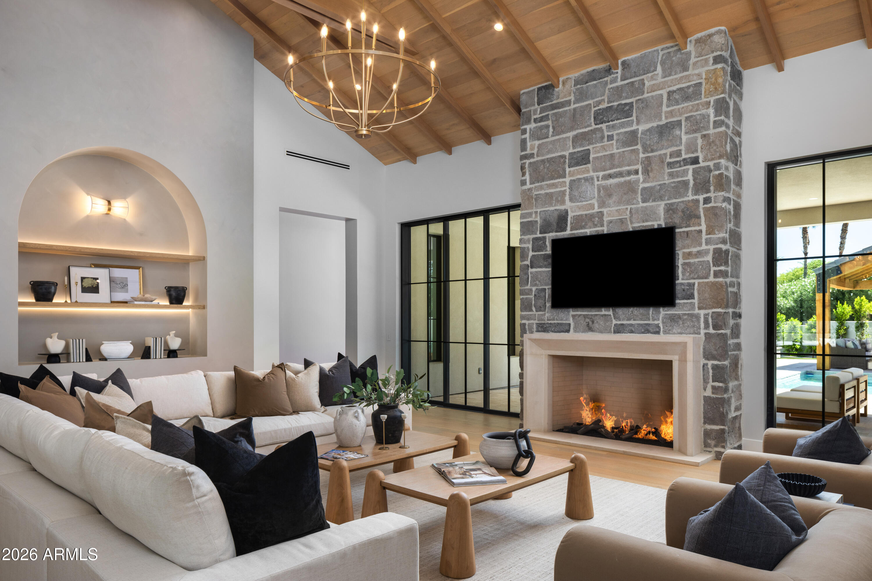 2026 new-construction,  7,810 square feet, single-level, on a one-acre lot at the end of a cul-de-sac, on a private six-home street with no HOA, Gated motor court with stone- pilared entry. Direct Mummy Mountains views

That's probably how most listing descriptions would start. But the truth is, that doesn't really tell you what this home feels like.

Every element of this home reflects exceptional craftsmanship, with many of the materials, finishes, and architectural details being custom-made, handcrafted, and specially sourced for this residence.

From the private cul-de-sac setting, wine cellar, custom bar, and view deck to the expansive outdoor living spaces, custom handcrafted wood primary closet, fully integrated smart home system, and an impressive service kitchen with pantry. This home is designed to feel warm, inviting, and incredibly livable. It's the kind of home where luxury doesn't feel formal; it feels comfortable.

The kitchen is anchored by Ilve range with a full Miele appliance suite -- refrigeration columns, wall ovens, plumbed coffee system, dishwasher, and hood. Oversized island, walk-in pantry, and a fully
separate commercial-grade prep kitchen. Whole-home Control4 automation governs lighting, climate, audio, shades, security, and entry.


Then there's the garage, a true 7-car capacity and lift-ready height, making room for up to 10 or 11 vehicles. For car enthusiasts, that's a game-changer.

The backyard is equally impressive, with enough space to add a pickleball court, sport court, or create your own private resort experience. Simply put, this home offers possibilities that most luxury properties can't.

It's one of those homes you simply have to experience in person.