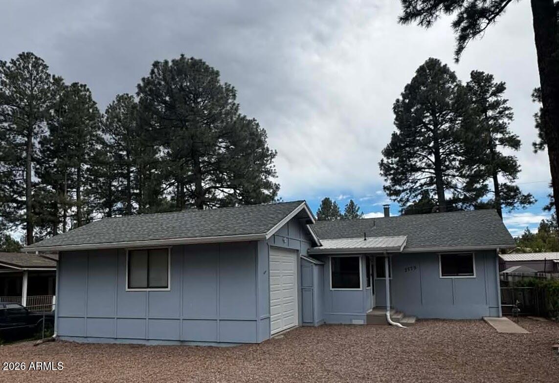 Nestled among the towering pines of Lakeside and just minutes from Lake of the Woods, this charming mountain retreat combines rustic character, everyday functionality, and year round comfort. Located in a peaceful neighborhood with no HOA, this 1,021 square foot home is an excellent option for a primary residence, weekend getaway, or investment property in Arizona's beautiful White Mountains. Inside, warm wood accents, vaulted ceilings, and abundant natural light create an inviting atmosphere. The spacious living room features a striking stone accent wall that enhances the home's cozy cabin appeal. The open layout connects the living, dining, and kitchen areas, making it ideal for both daily living and entertaining. Offering 2 bedrooms and thoughtfully designed living spaces, the home Provides comfort and flexibility. Large windows frame the surrounding landscape, bringing the beauty of the pines indoors. Enjoy the outdoors from multiple gathering spaces, including a covered front porch and an extended patio perfect for relaxing or entertaining. The easy-care lot provides plenty of usable space while highlighting the natural beauty of the area. Additional amenities include a detached garage and generous parking options. Conveniently located near lakes, hiking trails, fishing, and outdoor recreation, this property offers easy access to the activities that make Pinetop Lakeside such a desirable destination. Experience cool mountain temperatures, fresh air, and all four seasons just a short drive from the Valley. Whether you're searching for a mountain escape, a potential vacation rental, or a peaceful place to call home, this property presents an opportunity worth exploring.