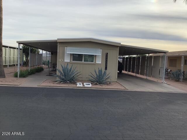 Enjoy the breath-taking views of the Superstition Mountains from this well-situated 2-bedroom, 2 bathroom furnished home located is the desirable Raindance Mobile Home Park. This home offers comfortable living with the added convivence of a golf cart garage and a charming she shed-perfect for hobbies, storage or a private retreat. Take full advantage of the active community lifestyle with amenities that include a sparkling pool, workout room, pickleball courts, billiards room and more. Ideal t=for those seeking scenic surroundings, functionally, and resort style living all in one place.