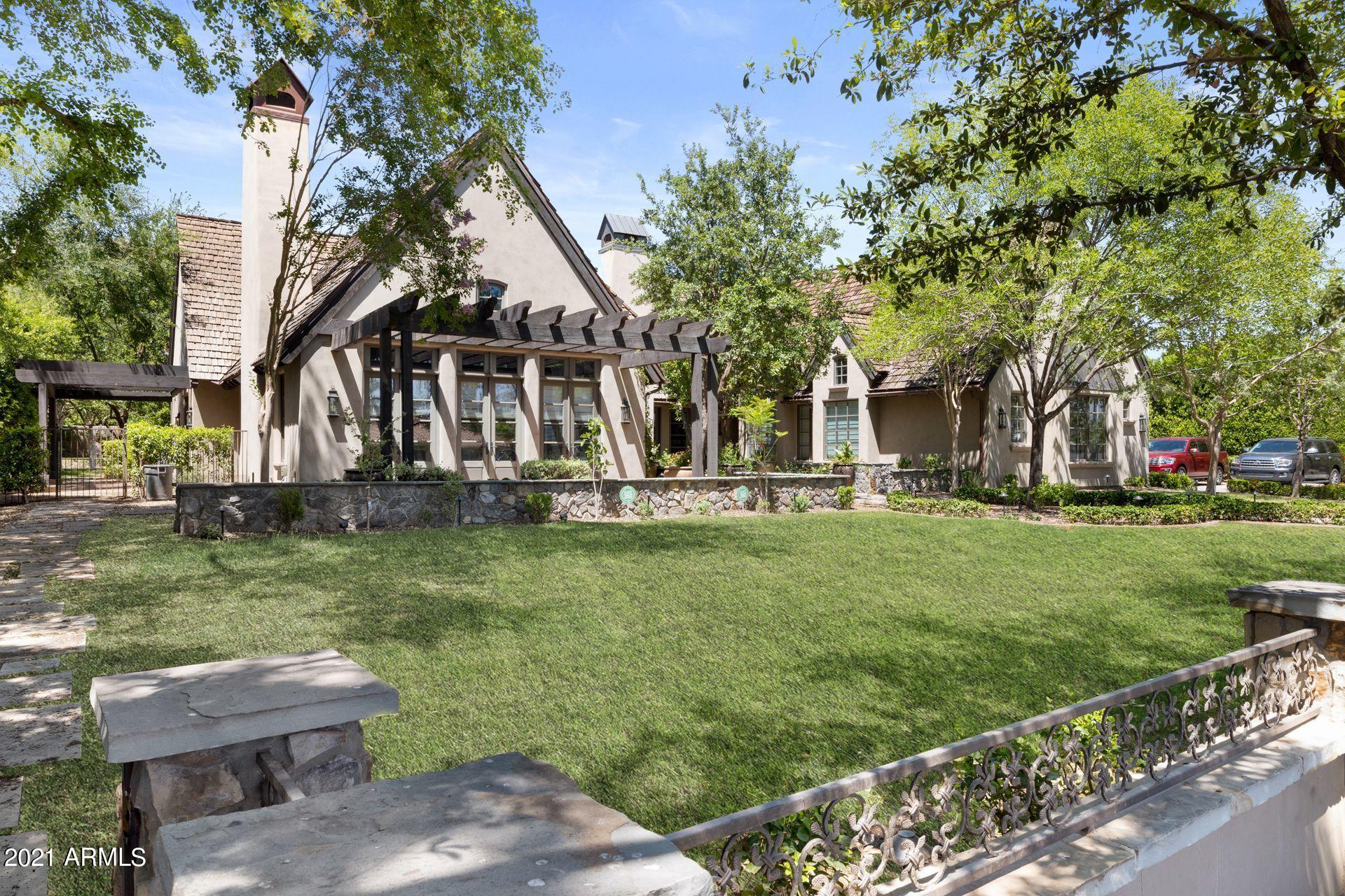 Sprawling gated Arcadia estate on a cul-de-sac street- Beautiful quality and design that you would expect in an SRJ Construction home with 6'' hand scraped walnut plank flooring.  Two custom stone fireplaces imported from Europe, hand scraped beamed ceilings, custom millwork 
through out- Home is a single level, there is a one bedroom, 1 bath loft above garage.   Incredible yard, ideal for entertaining w/ a huge spillover pool and spa.  Separate guest house and motor court complete this magnificent estate.