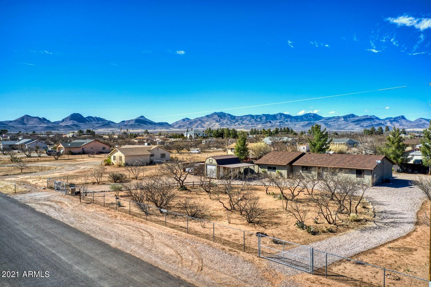 Beautiful Whetstone listing!  Want a bit of room to stretch out just minutes from Sierra Vista?  This 3 bedroom 2 bath home has SO much to offer.  Beautiful tile flooring in living room and great room.  New AC and heat with all new ducting!  Sun screens on front windows.  New Exterior paint. New chain link fence with privacy slates with a 25 year warranty.  This home is the perfect size for your growing family.  HUGE master bedroom with access to backyard.  Large walk-in shower.  The 2 Carports/walk-in shed is brand new and has TONS of storage.  This home even has a separate private courtyard off the great room perfect for entertaining. Even 2 peach trees and 2 apple trees.  You won't find a nicer home for the price!  Call to view today.