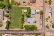 LOCATION, LOCATION, LOCATION! Rare opportunity to own a prime close to 2-acre corner lot with NO HOA in a desirable Chandler County Island. This flat, easy-to-build parcel is the perfect canvas for your custom dream home and already has all utilities in place, including septic—streamlining your build process. The property currently features a manufactured home that can serve as temporary housing during construction, plus a large 30X33 3-car garage, two additional structures: one could easily be an AUD with half bath, full utilities and separate septic tank, & additional storage building, offering endless possibilities for use. Surrounded by beautiful custom homes, this is the best-priced lot in the area, with water, electric, and irrigation available. Seller is offering the property AS-IS, no repairs to be made. Don't miss your chance to design your own private oasis without HOA restrictions! Please note: Cross-posted in Residential also MLS # 6916623