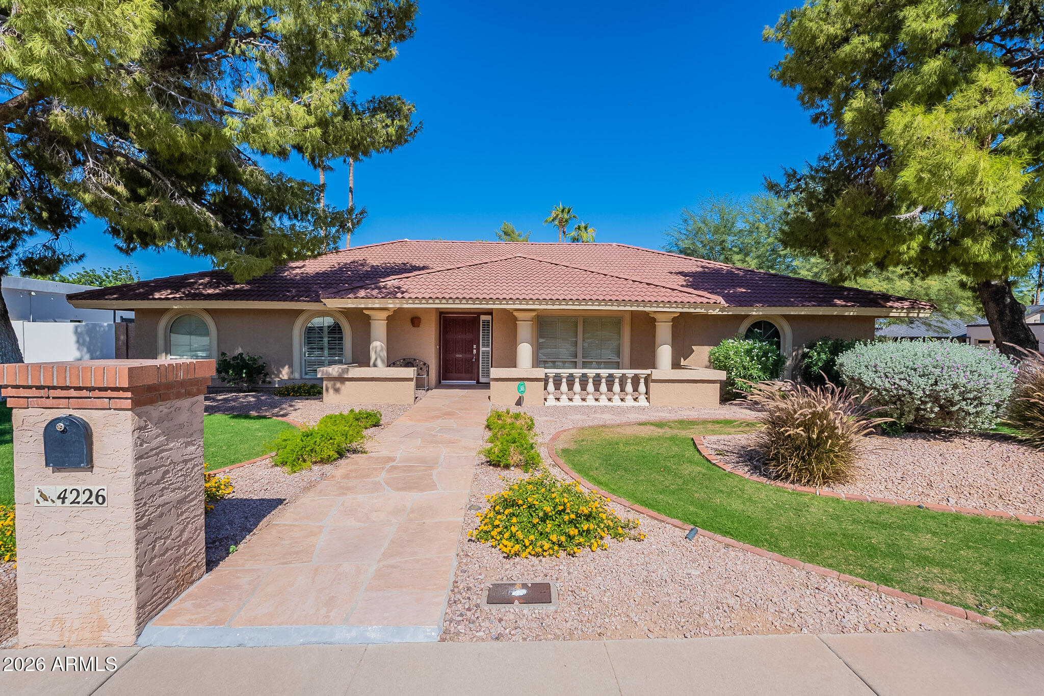 Corner lot in a prime, central location. This thoughtfully designed 3 bedroom home features a great room floor plan with vaulted ceilings and beautiful architectural details throughout. Enjoy seamless indoor outdoor living with a lush backyard and sparkling pool, perfect for relaxing or entertaining. Located in the highly sought after Scottsdale School District with easy access to the Phoenix Mountain Preserve for hiking and outdoor living. Just minutes to top dining, shopping, SR 51, and Sky Harbor for an easy commute. Opportunities in Paradise Valley Foothills are rare, this is one to see.