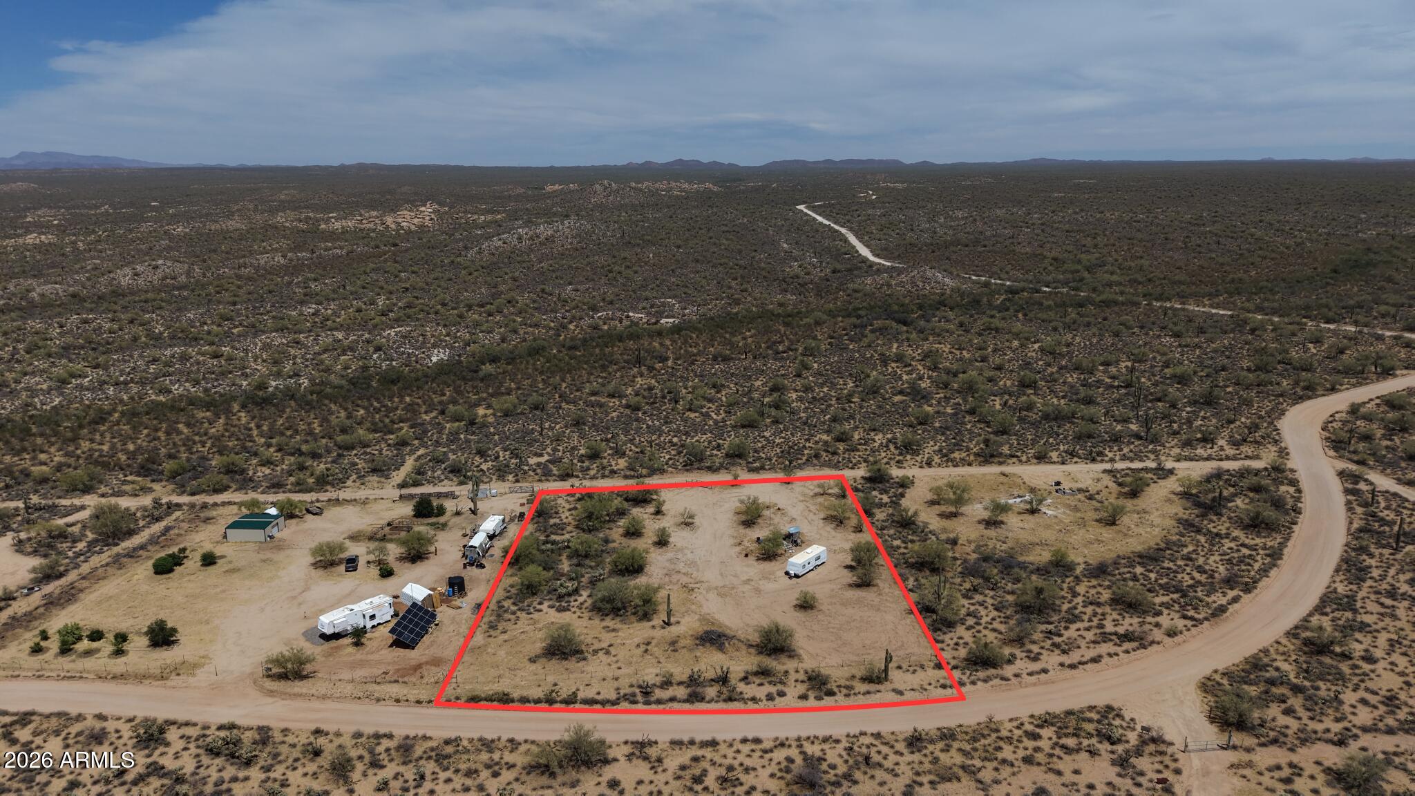 1.64 acres of flat, beautiful Arizona desert land ready for your dream home, mini-ranch, or weekend getaway. A shared well is already installed, giving you a great head start -- buyer will need to install septic. Enjoy wide-open space away from the hustle, bustle, and traffic of town with room for horses, animals, toys, hobbies, gardens, or a peaceful homestead setup.

Bring your vision and make this desert property your own!

All facts, figures, utilities, zoning, well information, and measurements are buyer's due diligence.