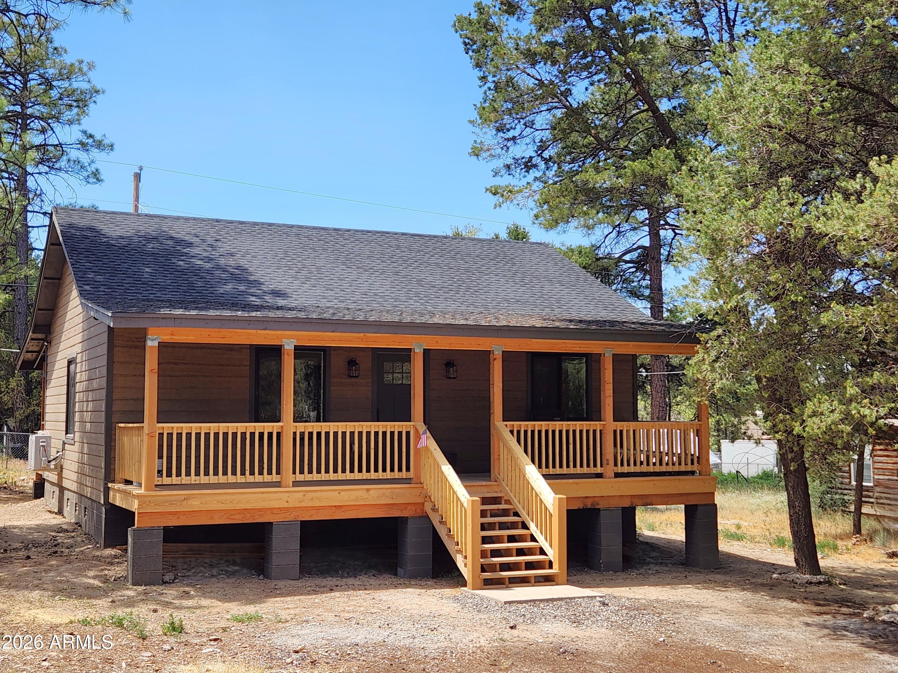 Built in 2026, this beautifully crafted 2-bedroom, 1-bath cabin offers worry-free living with all-new construction, modern finishes, and quality craftsmanship throughout. Relax on the spacious front porch while taking in the crisp mountain air, towering pines, and peaceful surroundings. Inside, the open floor plan features luxury vinyl plank flooring, stunning quartz countertops, custom cabinetry, and a kitchen complete with all brand-new appliances. Durable LP SmartSide® siding provides lasting beauty and low-maintenance appeal. Whether you're looking for a full-time residence or a weekend retreat, this move-in-ready cabin is the perfect place to relax, unwind, and make lasting memories. Enjoy the confidence and peace of mind that comes with owning a brand-new home!