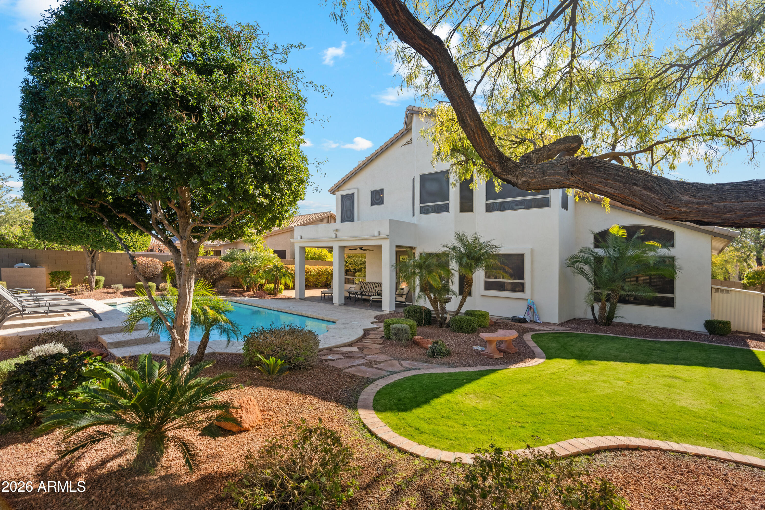 COMING SOON! Get ready to fall in love with this completely renovated two story home in Tatum Ranch on a prime lot! Featuring 2 x 6 construction and so much attention to details! From the moment you walk in, you will be greeted by the grand entry, soaring vaulted ceilings and elegant staircase. The original owners have put so much into this home. The kitchen was redone with quartz countertops, custom cabinets and gas stove/oven. All of the flooring was replaced and the gas fireplace was completely redone. Enjoy a huge primary bedroom with updated bathroom featuring garden tub, separate shower, dual sinks & vanity with marble countertops and his and her walk-in closets. Secondary bedrooms are generously sized with one of them located downstairs. Backyard is complete with play pool, covered patio, grass area, relaxing fountain and no neighbors directly behind! You don't want to miss this.