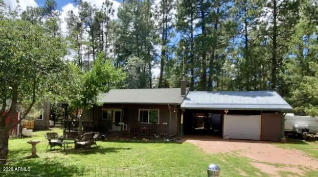 Nestled in the beautiful 4 season Tonto National Forest, this charming 2-bed home offers a perfect blend of personal enjoyment & investment potential. This property has been a successful rental for four years, showcasing a proven track record for income generation. Make this a permanent home, a summer & winter retreat, or continue to run it as a successful investment. Updates: newer water heater, new mini split system, newer ceiling fans, an evap. cooler, ceramic heaters, oil-filled radiator heater, cast iron pellet stove. updated bathrooms, newer flooring in mud/laundry room, kitchen, bathrooms. Home is equipped with a stackable washer/dryer. Included is a 13x13 tin shed, 24x25 carport, apple trees, BBQ, firepit, security doors and is fully fenced. Forest access one block away!