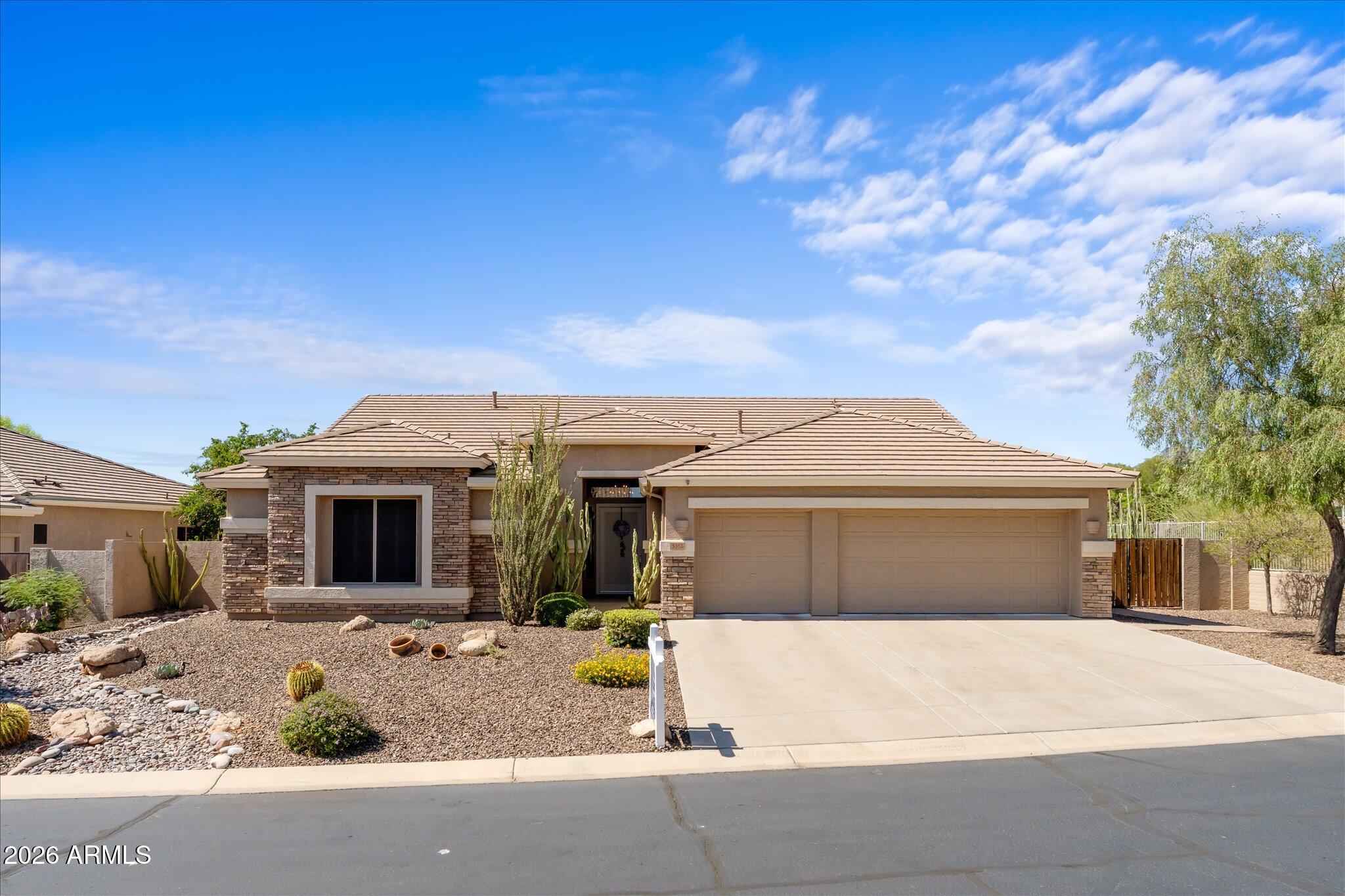 Stunningly Updated Desert Oasis in Gated Colina del Norte! Backs and sides to a serene desert wash with mountain views, this beautiful north/south exposure home blends modern luxury with resort-style living. Featuring 3 bedrooms, plus a den/flex room, 3 full baths, and a 3-car garage, it offers the perfect layout--plus total peace of mind with a new roof replaced in 2025. The sleek, modern interior boasts large platform tiles and a chef's kitchen with quartz countertops, glass tile backsplash, SS appliances, gas cooktop, coffee bar, and an oversized island with seating. The kitchen flows seamlessly into a bright family room, anchored by a dramatic stacked-stone electric fireplace and a wall of windows overlooking the large diving pool. Backyard has built in BBQ, large covered patio