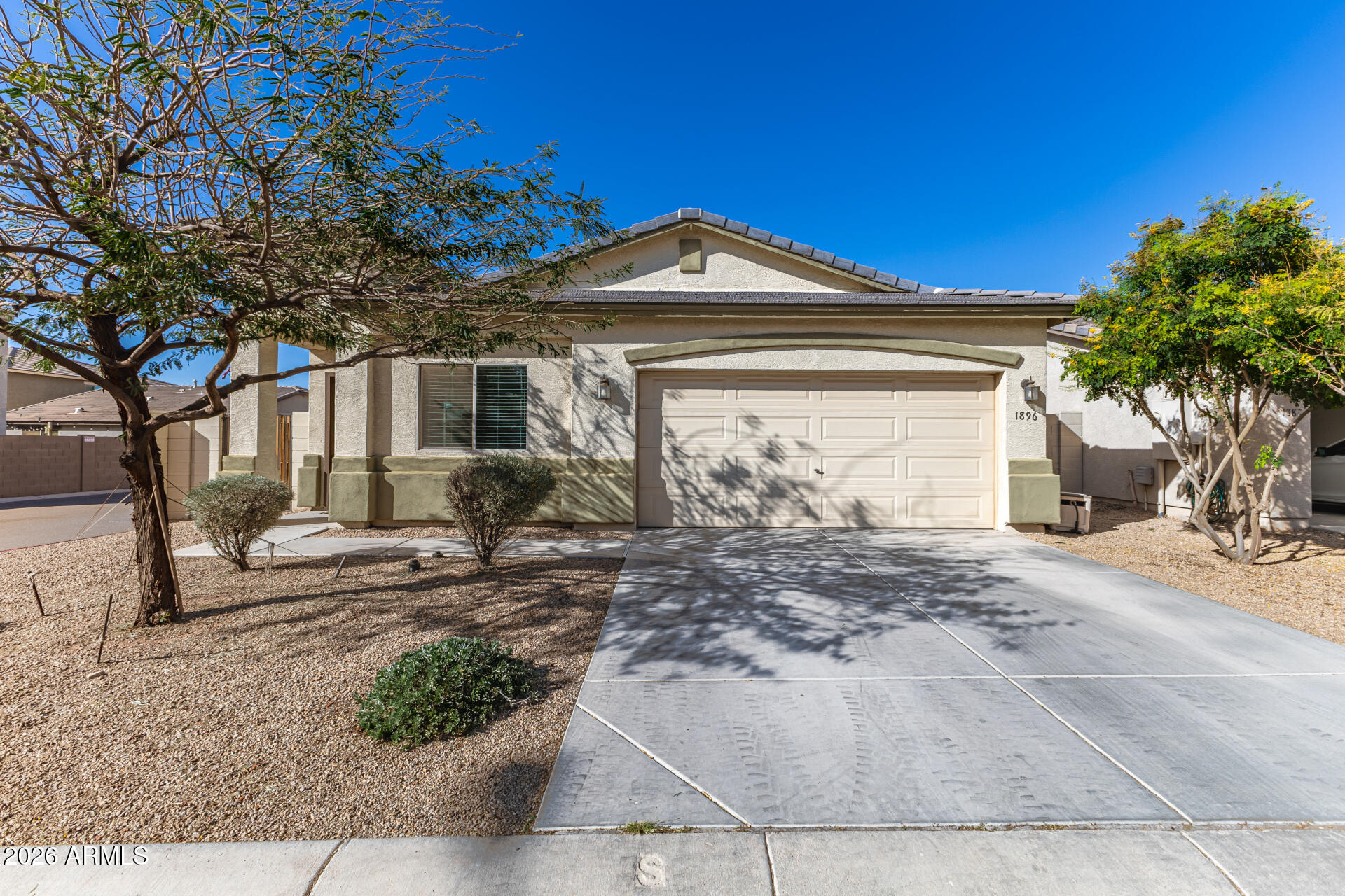 Welcome to 1896 W Road Agent, located in the heart of the Stage Coach gated Community on a corner lot. The interior features an open floor plan with a spacious living area, tile flooring throughout, and abundant natural light. The kitchen offers ample cabinetry, granite countertops, and convenient access to the dining area. The primary bedroom includes an en-suite bathroom, while the second bedroom provides flexibility for guests, a home office, or additional living space. Exterior features include a low-maintenance yard and covered patio area. Corner lot location offers additional privacy and space between neighboring homes.