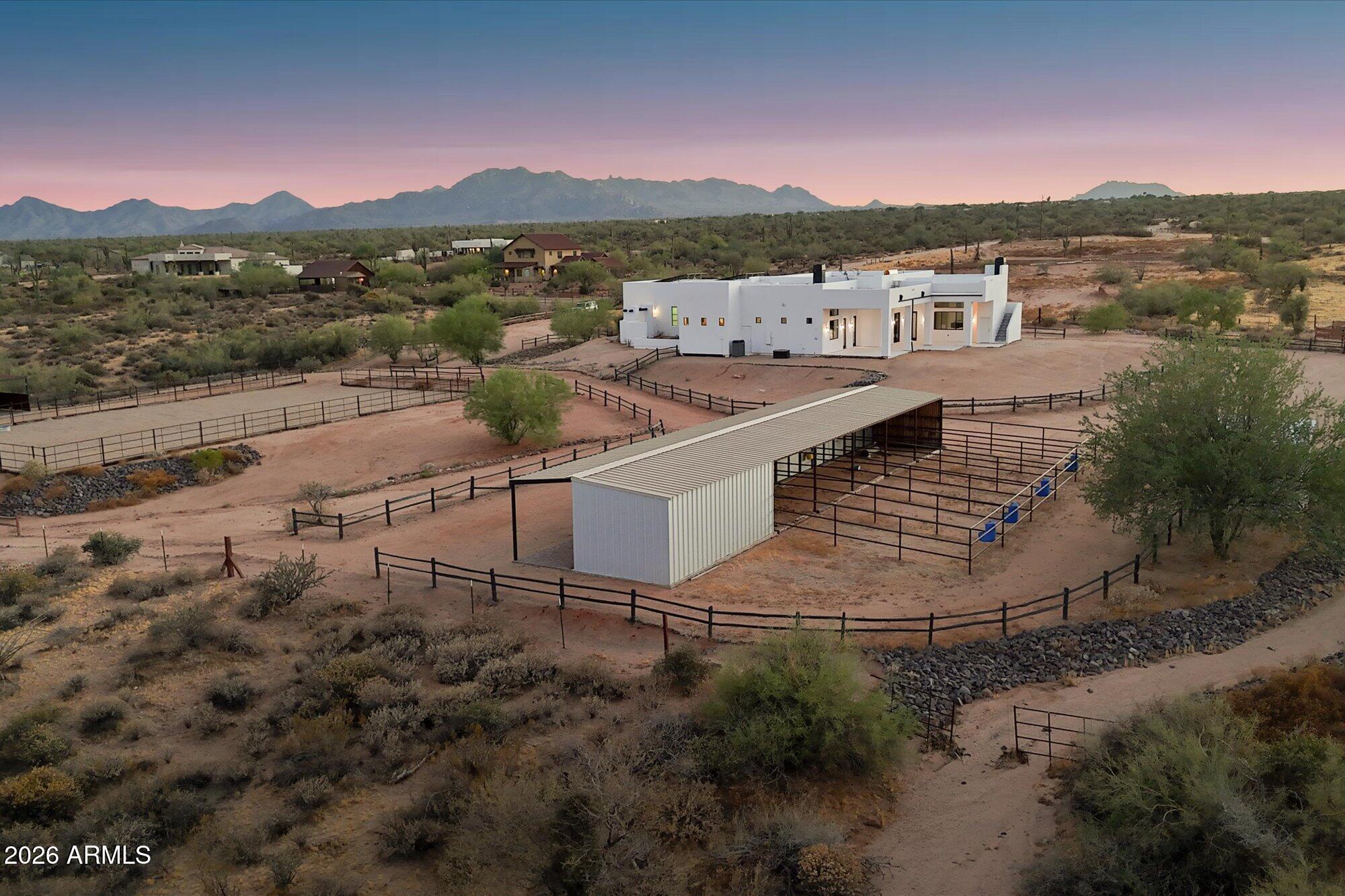 Discover Buckhorn Ranch, a rare equestrian estate nestled on nearly 2.5 acres in the scenic Rio Verde Foothills. This custom built 4 bedroom, 4 bathroom home offers more than 3,400 square feet of comfortable living space with panoramic views of Four Peaks and the surrounding desert landscape. Designed with horse enthusiasts in mind, the property features a 60x120 arena, 6 stall barn with European stall fronts, round pen, wash racks, tack room, and feeding room. An owned solar system, oversized garage, and private setting complete this exceptional opportunity to enjoy Arizona ranch living at its finest.