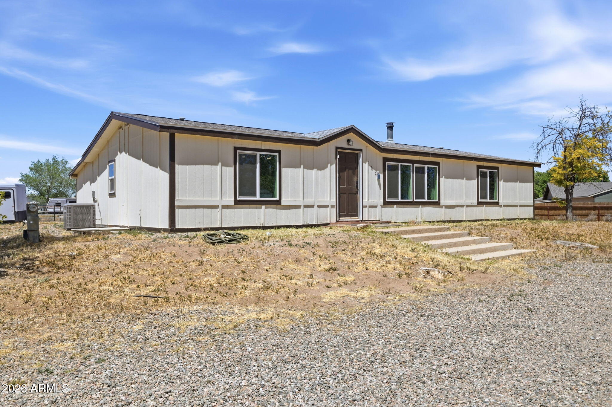 This is the kind of home that just feels right the moment you pull up. Set on a full acre with no HOA, you get that rare combination of freedom, space, and a home that's been completely refreshed to feel modern and move-in ready. Everything is on one level, which makes daily living simple and comfortable. Inside, the layout opens up beautifully--natural light pours in through large windows, and the living, dining, and kitchen areas all connect in a way that feels easy and inviting. Whether you're hosting friends or just enjoying a quiet night in, the space works effortlessly. The kitchen is one of those spots you'll actually enjoy spending time in. It's been fully updated with sleek countertops, stainless steel appliances, tons of storage, and a walk-in pantry that keeps everything organized and within reach. The primary bedroom gives you your own private retreat, complete with a walk-in closet and a spa-like bathroom--think a soaking tub, upgraded shower, and a backlit mirror that adds a clean, modern touch. The additional bedrooms are generously sized (both with walk-in closets), and even the guest bathroom carries that same elevated, polished feel. There's also extra flexibility built into the home, especially in the laundry area--it's large enough to double as a hobby space, craft room, or just extra storage when you need it. Step outside, and this property really starts to shine. The fully fenced acre gives you room to breathe and space to create--garden, play, park your RV, bring your horses, or just enjoy the quiet. It's yours to use how you want. And behind the scenes, all the important upgrades are already done: new flooring, new windows, updated plumbing and electrical, a new propane furnace and HVAC system, plus fresh paint inside and out. Even the small details--like hidden LED lighting--add to the overall feel of quality and care. If you've been waiting for a place that offers both modern updates and the kind of space you just can't find in most homes... this might be the one.