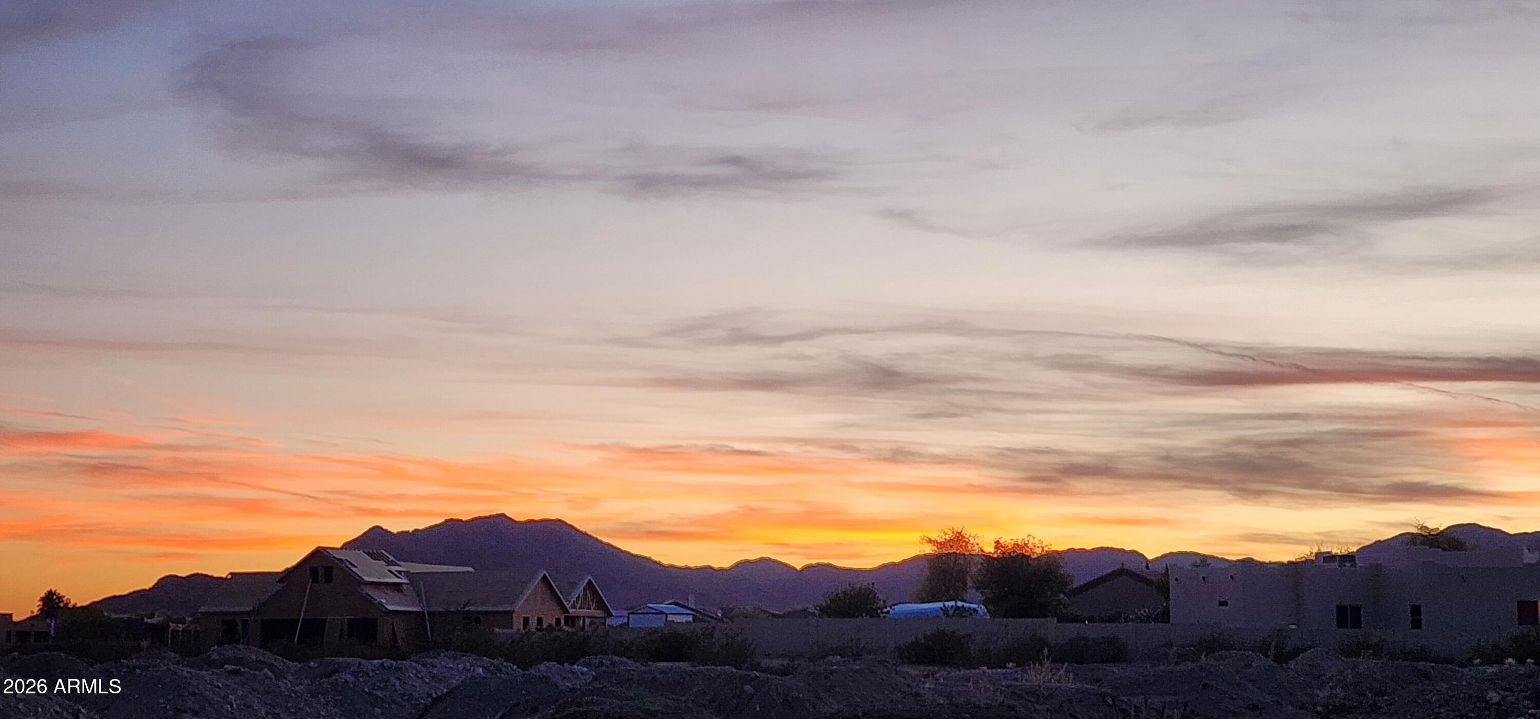 Build your custom dream home on this flat 1 Acre CORNER LOT in beautiful Litchfield Heights! Located in a quiet neighborhood surrounded by custom homes. (Million dollar + homes) This property offers stunning views of The White Tank Mountains. Majestic sunsets year-round!! Nearby golfing, horseback riding, hiking, biking, etc. Near the Verrado master planned development. Plenty of room for your ideal Home Layout, Pool, Detached Garage or Workshop. Enjoy peaceful living with convenient access to I-10, shopping, and dining. NO HOA-bring your own builder & imagination, and create the perfect desert retreat!  :-)

Utilities: Water, Elec, Comm nearby
Sewer: Perc Test was completed in 2020; soil test good for Conventional Septic System
Stipulations: All information herein to be verified by bu