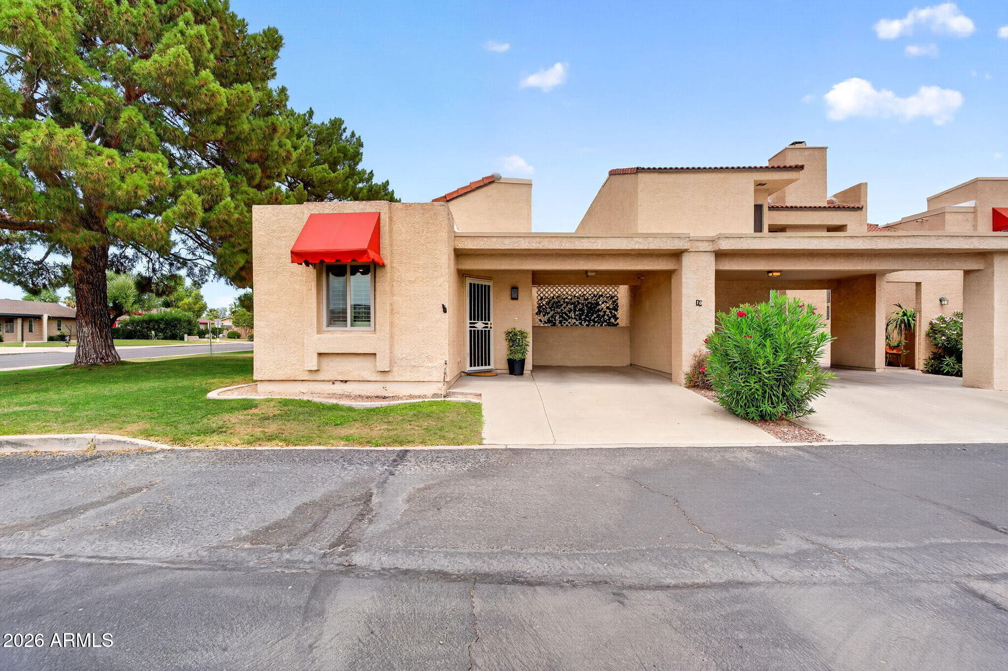 RARE OPPORTUNITY TO OWN A CORNER UNIT IN HIGHLY SOUGHT-AFTER MOON VALLEY--THESE RARELY COME ON THE MARKET! Ideally located just moments from Moon Valley Country Club, this meticulously maintained 1-bedroom, 1-bathroom condo with a dedicated office/den has been kept in remarkable condition and offers the perfect blend of comfort, flexibility, and convenience in one of North Phoenix's most desirable communities.
Step inside to soaring vaulted ceilings and abundant natural light that create an open, airy feel throughout the living space. A striking floor-to-ceiling stone fireplace serves as the focal point, adding warmth and timeless character. In addition to the spacious primary suite, you'll find a versatile bonus room perfect for a home office, den, guest space, or hobby room--providing flexibility rarely found in a one-bedroom home.

The thoughtfully designed floor plan features granite countertops, stainless steel appliances, plantation shutters, extensive custom built-in storage, and pride of ownership throughout. Enjoy Arizona's beautiful weather from your private courtyard patio, ideal for morning coffee or evening relaxation.

Residents enjoy access to a community pool, all while being conveniently located near golf, hiking, shopping, dining, and easy freeway access. Whether you're seeking a full-time residence, seasonal retreat, or investment property, this low-maintenance lock-and-leave opportunity offers exceptional value in a premier Moon Valley location.
