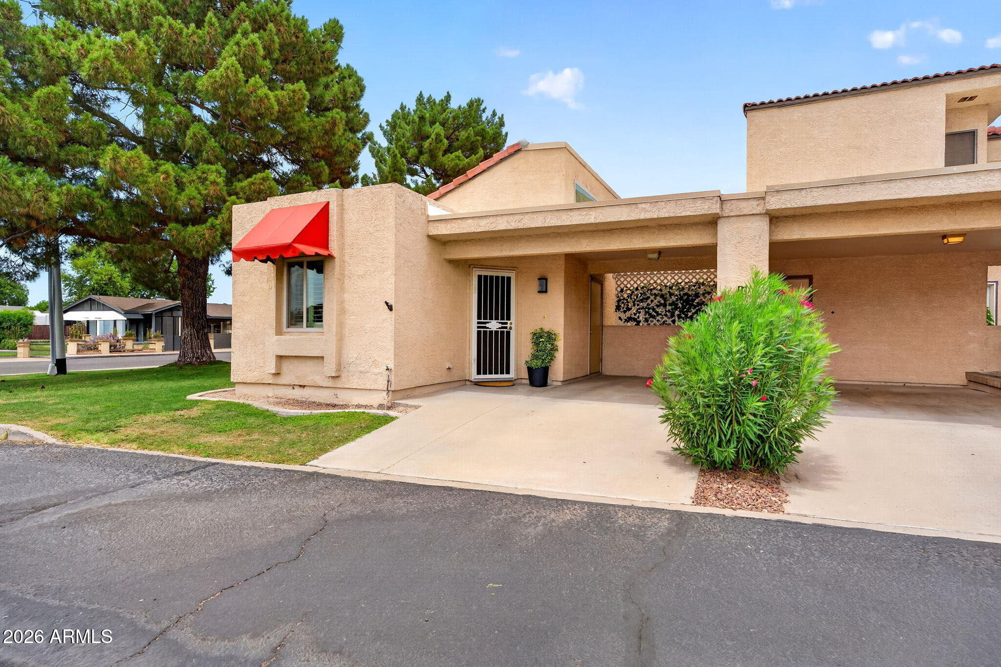 RARE OPPORTUNITY TO OWN A CORNER UNIT IN HIGHLY SOUGHT-AFTER MOON VALLEY--THESE RARELY COME ON THE MARKET! Ideally located just moments from Moon Valley Country Club, this meticulously maintained 1-bedroom, 1-bathroom condo with a dedicated office/den has been kept in remarkable condition and offers the perfect blend of comfort, flexibility, and convenience in one of North Phoenix's most desirable communities.
Step inside to soaring vaulted ceilings and abundant natural light that create an open, airy feel throughout the living space. A striking floor-to-ceiling stone fireplace serves as the focal point, adding warmth and timeless character. In addition to the spacious primary suite, you'll find a versatile bonus room perfect for a home office, den, guest space, or hobby room--providing flexibility rarely found in a one-bedroom home.

The thoughtfully designed floor plan features granite countertops, stainless steel appliances, plantation shutters, extensive custom built-in storage, and pride of ownership throughout. Enjoy Arizona's beautiful weather from your private courtyard patio, ideal for morning coffee or evening relaxation.

Residents enjoy access to a community pool, all while being conveniently located near golf, hiking, shopping, dining, and easy freeway access. Whether you're seeking a full-time residence, seasonal retreat, or investment property, this low-maintenance lock-and-leave opportunity offers exceptional value in a premier Moon Valley location.
