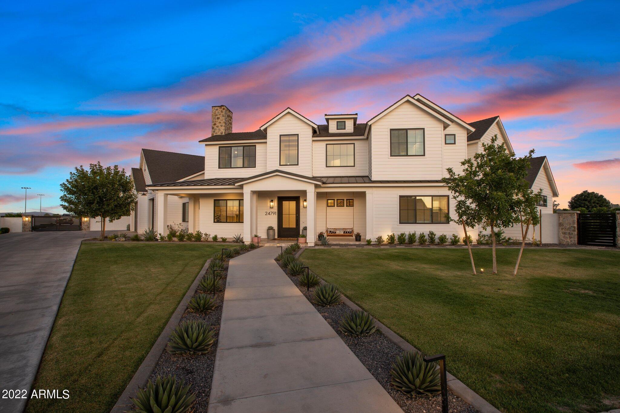 Wow! Just wow! If you are looking for a newer home with acreage & views that has absolutely every upgrade, this custom built contemporary dream home with a Casita & RV Garage in the highly desirable CUSD is for you!  Featuring lower level primary and guest bedrooms, office, indoor basketball court/gym with a great room and chef's kitchen with walk in pantry. Upstairs is a loft, covered deck and 3 additional bedrooms, this modern floorplan offers space for everyone!  You will be blown away by all of the storage & high end finishes in this home: white oak floors, wood beams, iron front door, mud room/drop zone, additional storage room off of garage with A/C,  quartz countertops, 6 burner gas stove, on trend contemporary design & oversized 3 car garage - this home has EVERYTHING. Entertaining is a dream in the massive backyard that features a shimmering fenced pool with Travertine decking complete w/a slide, basketball hoop, diving platform, shallow end and an elevated spa. There's also an outdoor kitchen, firepit, multiple seating areas perfect for sunbathing, a pickle ball court, & meticulous grass landscape with mature trees. Farm to table dinners are no problem with fresh produce from your garden. 
Words cannot describe this amazing value. See it! Love it! Live it!